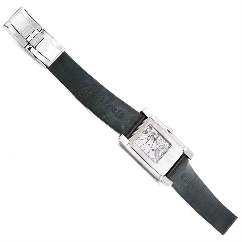 The Rolex Cellini 5443 Men's White Gold Black Dial 5443 Men's White Gold Black Dial watch is shown from the back, revealing its leather strap and visible movement through the caseback.