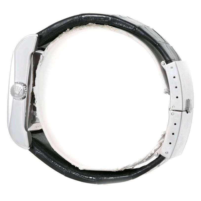 The image shows a side view of a Rolex Cellini 5443 Men's White Gold Black Dial 5443 Men's White Gold Black Dial model watch, highlighting the crown, case, and black leather strap.