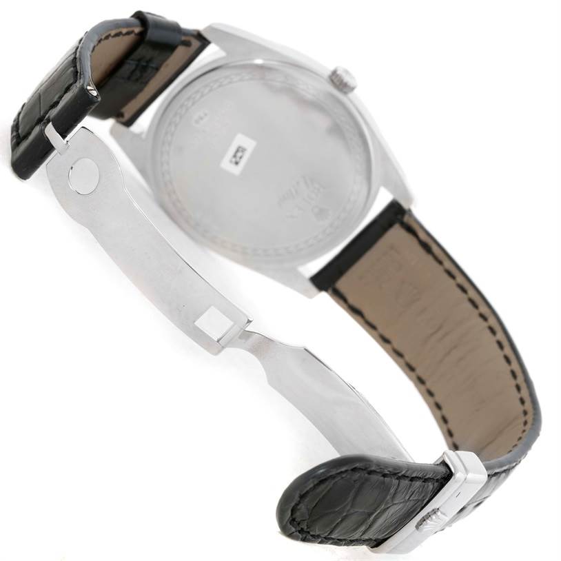 The image shows the back view of a Rolex Cellini 4243/8 Men
s White Gold Silver Dial 4243/8 Men
s White Gold Silver Dial watch, including its leather strap and deployment clasp.