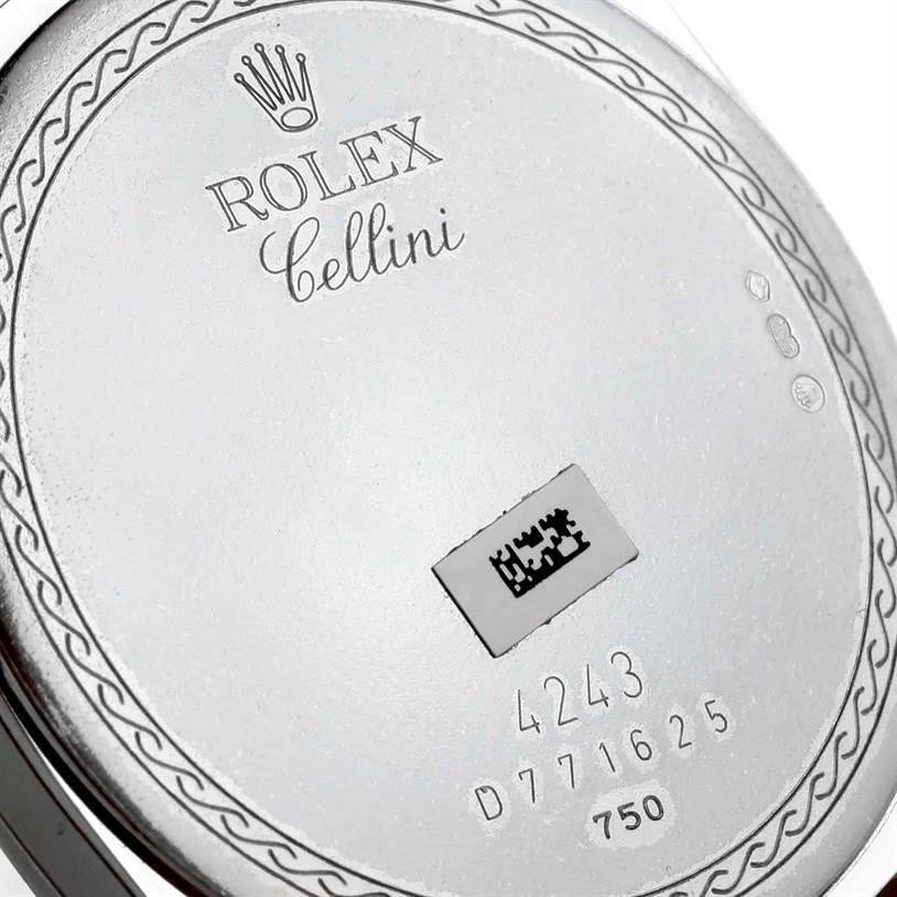 The image shows the back case of a Rolex Cellini 4243/8 Men
s White Gold Silver Dial 4243/8 Men
s White Gold Silver Dial model with engraved details and serial numbers.