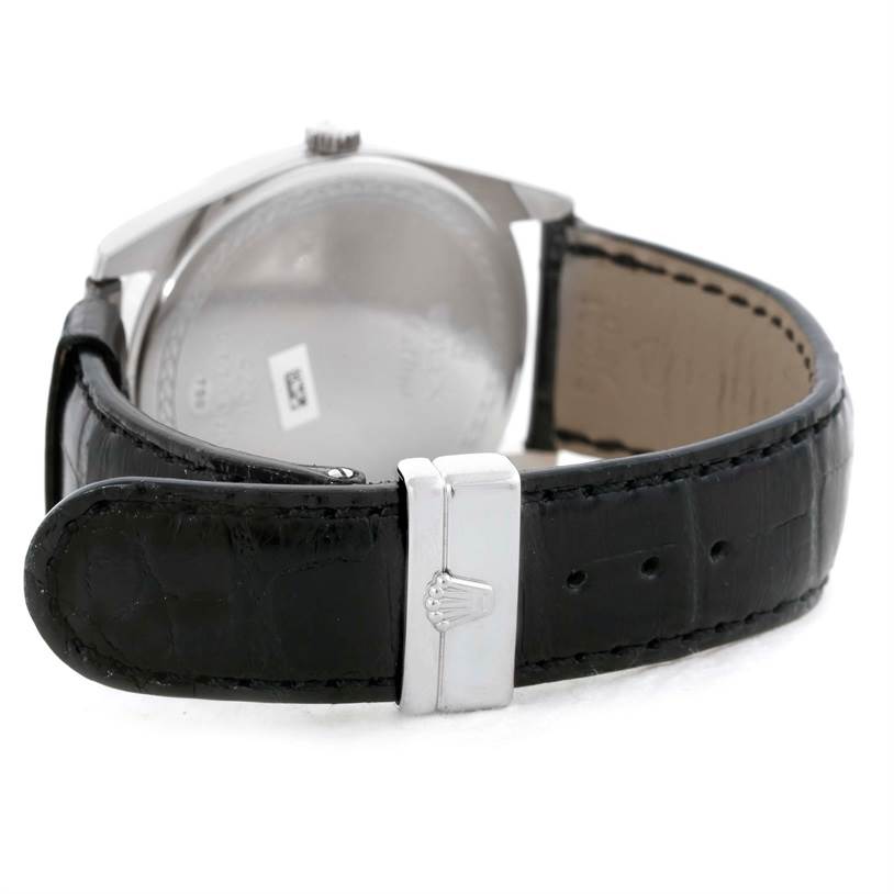 The image shows the back of a Rolex Cellini 4243/8 Men
s White Gold Silver Dial 4243/8 Men
s White Gold Silver Dial watch focusing on the clasp and leather strap.