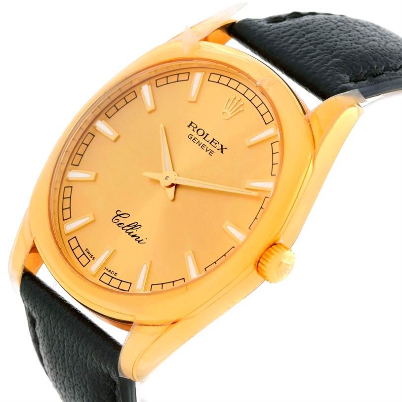 The image shows a Rolex Cellini 4243 Men's Yellow Gold Champagne Dial 4243 Men's Yellow Gold Champagne Dial wristwatch angled to display its gold dial, case, crown, and black leather strap.