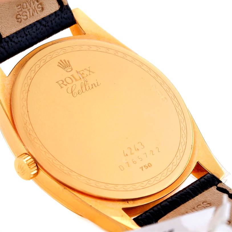 This image shows the back case of a Rolex Cellini 4243 Men's Yellow Gold Champagne Dial 4243 Men's Yellow Gold Champagne Dial watch, featuring the brand name, model name, and serial number.