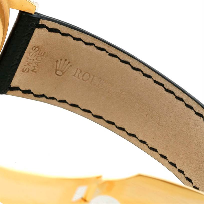 This close-up image shows the leather strap's interior, and part of the buckle of a Rolex Cellini 4243 Men's Yellow Gold Champagne Dial 4243 Men's Yellow Gold Champagne Dial watch.