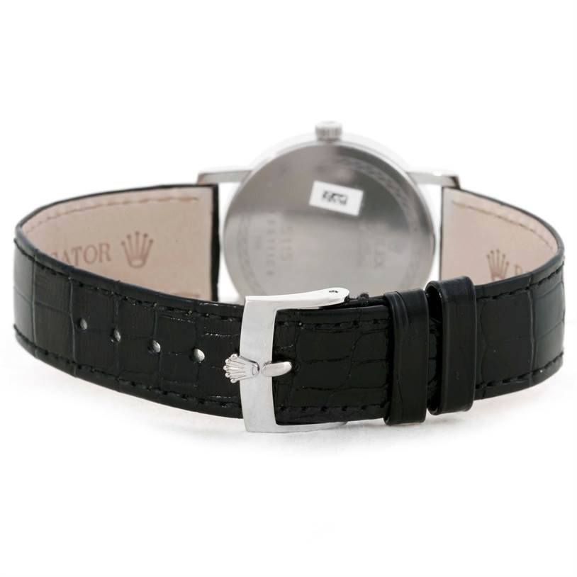 The image shows the back view of the Cellini model Rolex watch, highlighting the leather strap and clasp.