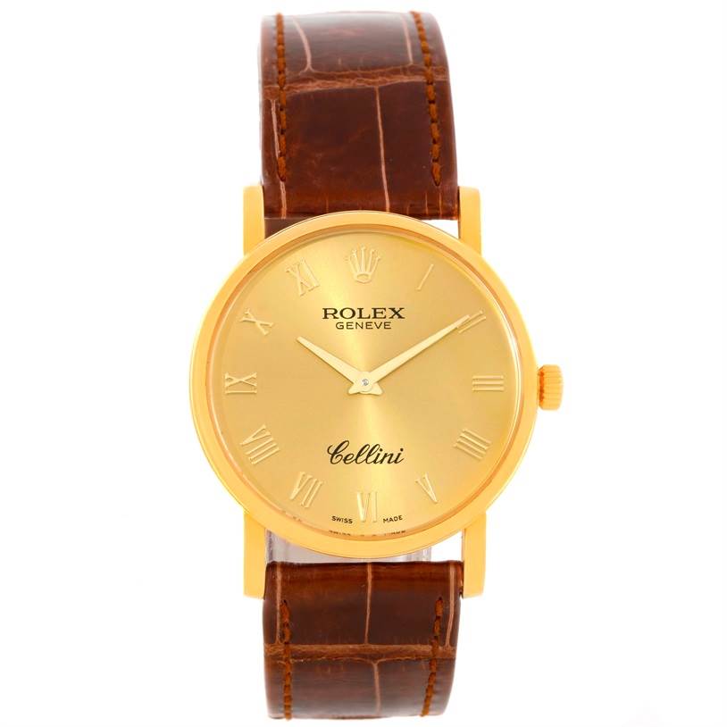 This image shows a Rolex Cellini 5115 Men
s Yellow Gold Champagne Dial 5115 Men
s Yellow Gold Champagne Dial watch from a front angle, featuring a gold dial, a brown leather strap, and a gold case.