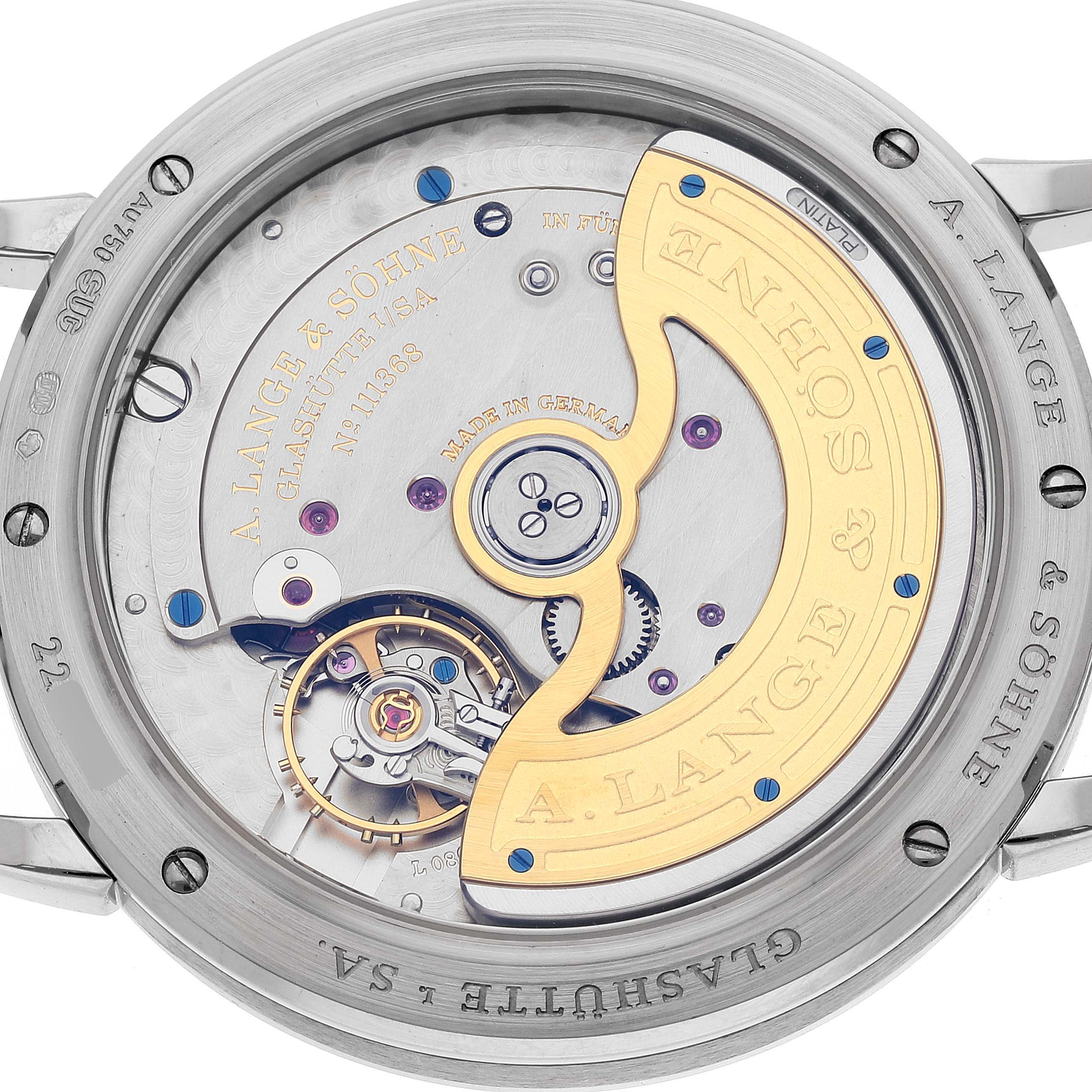 The image shows the back view of the A. Lange & Sohne Saxonia 380.027 Men's White Gold Silver Dial watch, highlighting its intricate movement and rotor.
