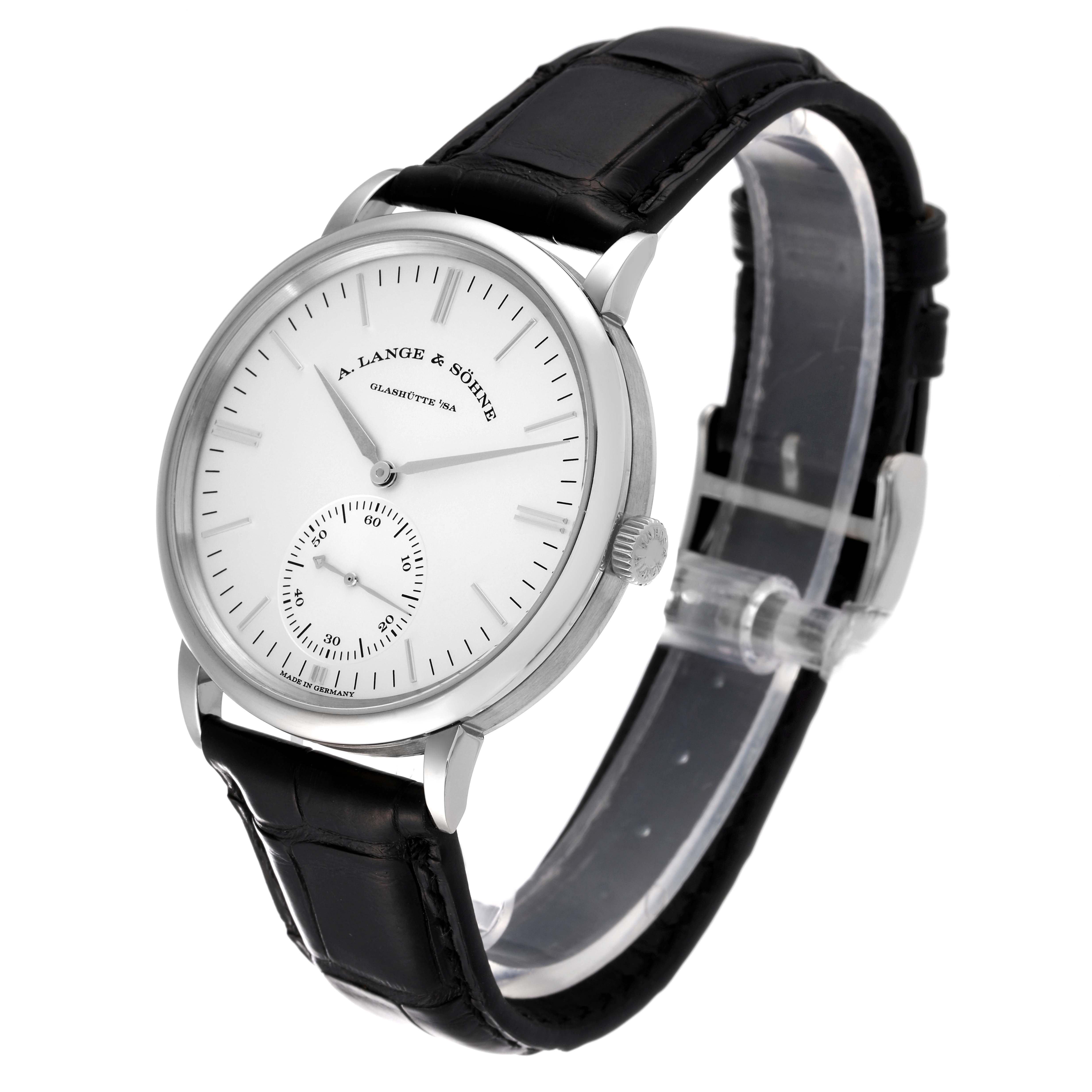 The image shows an A. Lange & Sohne Saxonia 380.027 Men's White Gold Silver Dial watch, angled to display its face, crown, and leather strap.