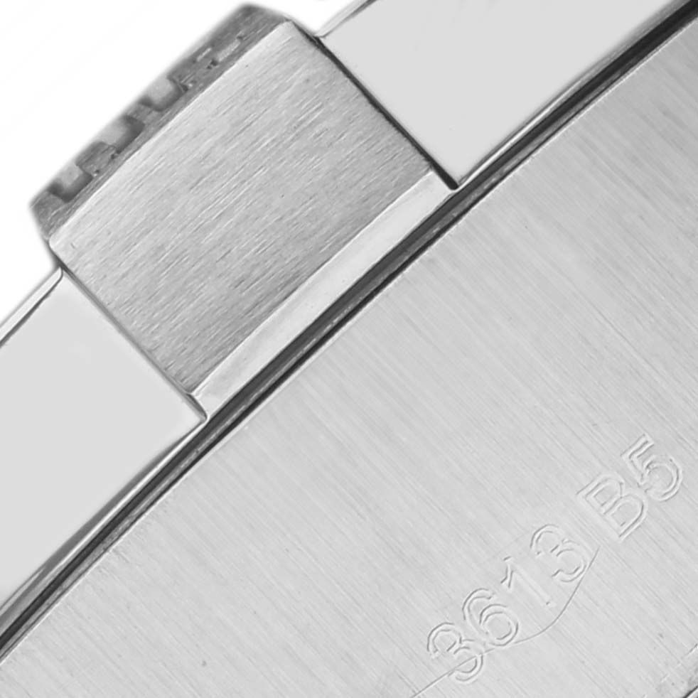 The image shows a close-up of the case back and edge of the Breitling Avenger A17331 Men's Stainless Steel Black Dial A17331 Men's Stainless Steel Black Dial watch, highlighting the brushed metal finish and engravings.