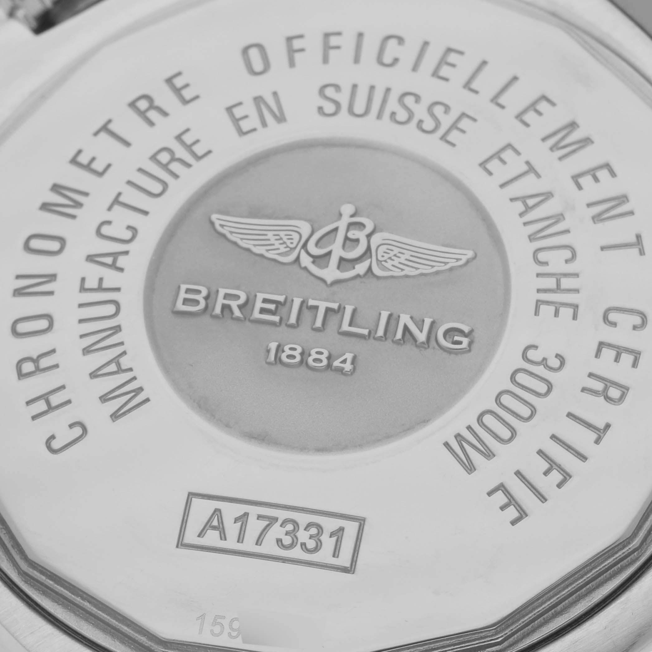 The image shows the back case of a Breitling Avenger A17331 Men's Stainless Steel Black Dial A17331 Men's Stainless Steel Black Dial watch featuring engravings of its specifications and model number.