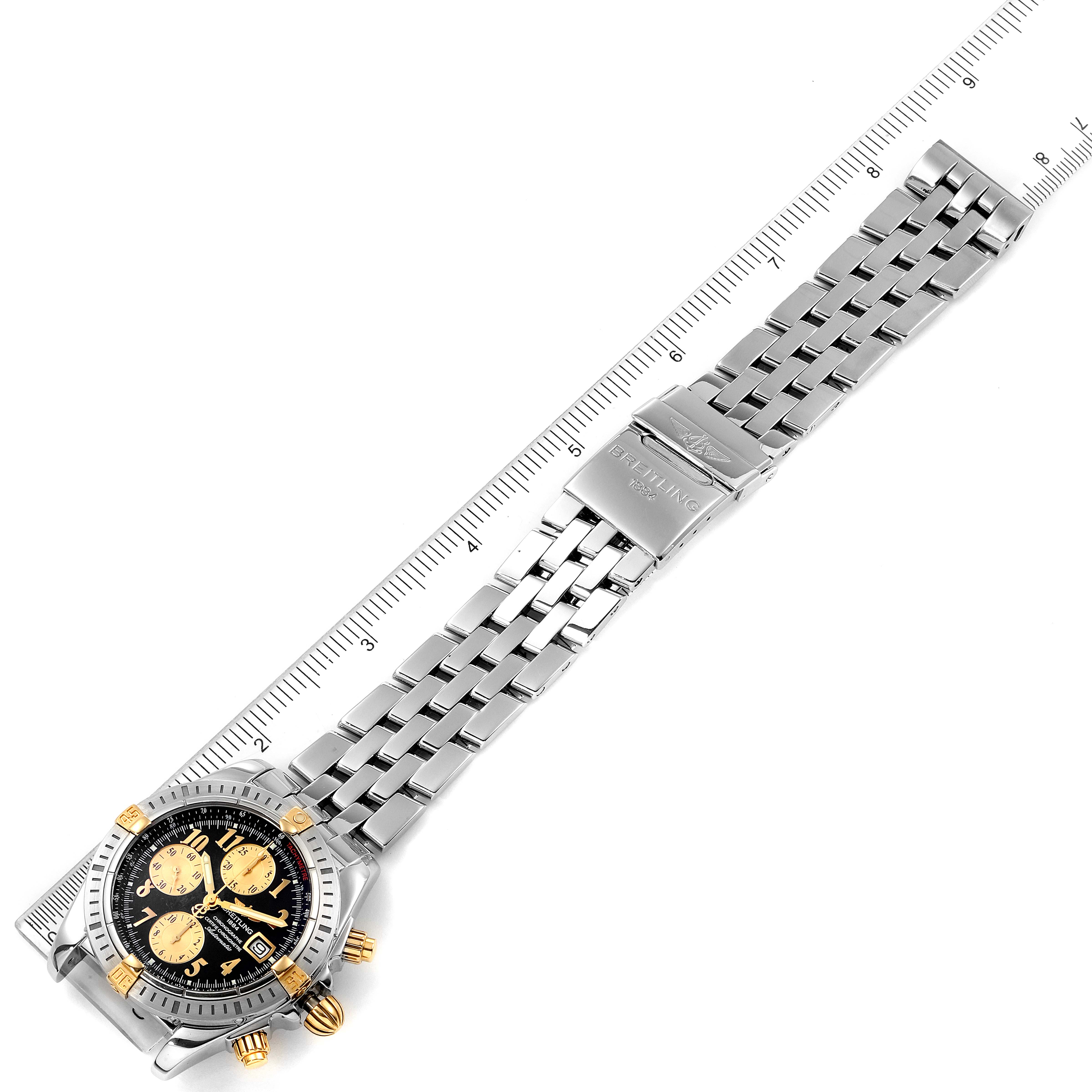 This image shows the Breitling Chronomat B13356 Men
s Stainless Steel Black Dial B13356 Men
s Stainless Steel Black Dial watch from an overhead angle, highlighting the face, bezel, and metal bracelet.