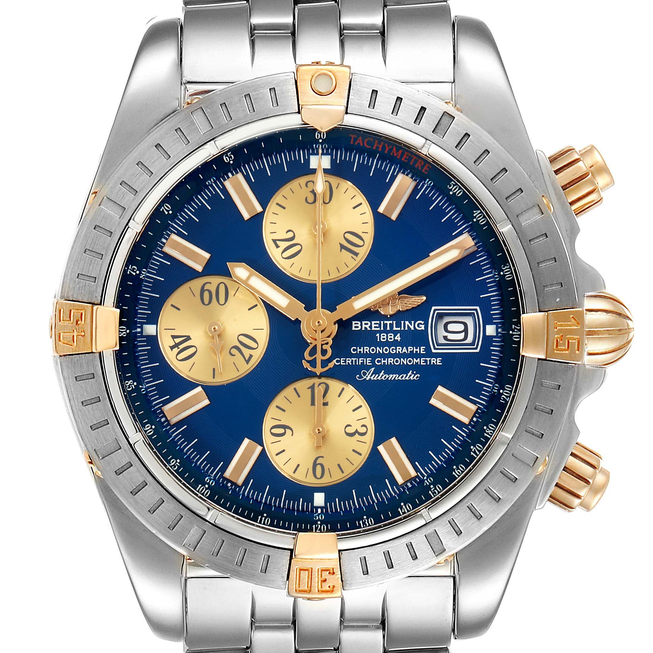 This image shows a front view of the Breitling Chronomat B13356 Men
s Stainless Steel Blue Dial B13356 Men
s Stainless Steel Blue Dial model, highlighting its blue and gold dial, metal bezel, and bracelet.