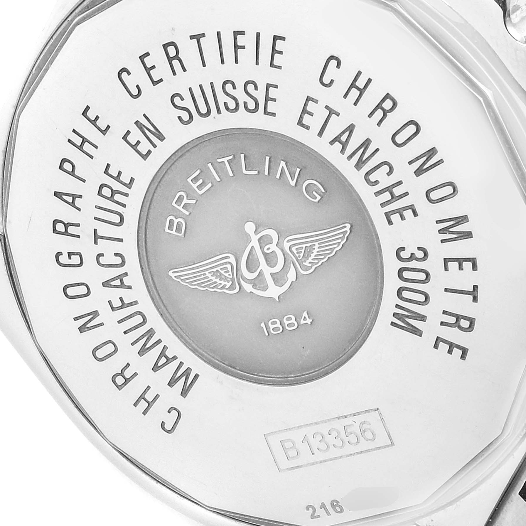 The image shows the back of a Breitling Chronomat B13356 Men
s Stainless Steel Blue Dial B13356 Men
s Stainless Steel Blue Dial watch, highlighting its engravings and serial number.