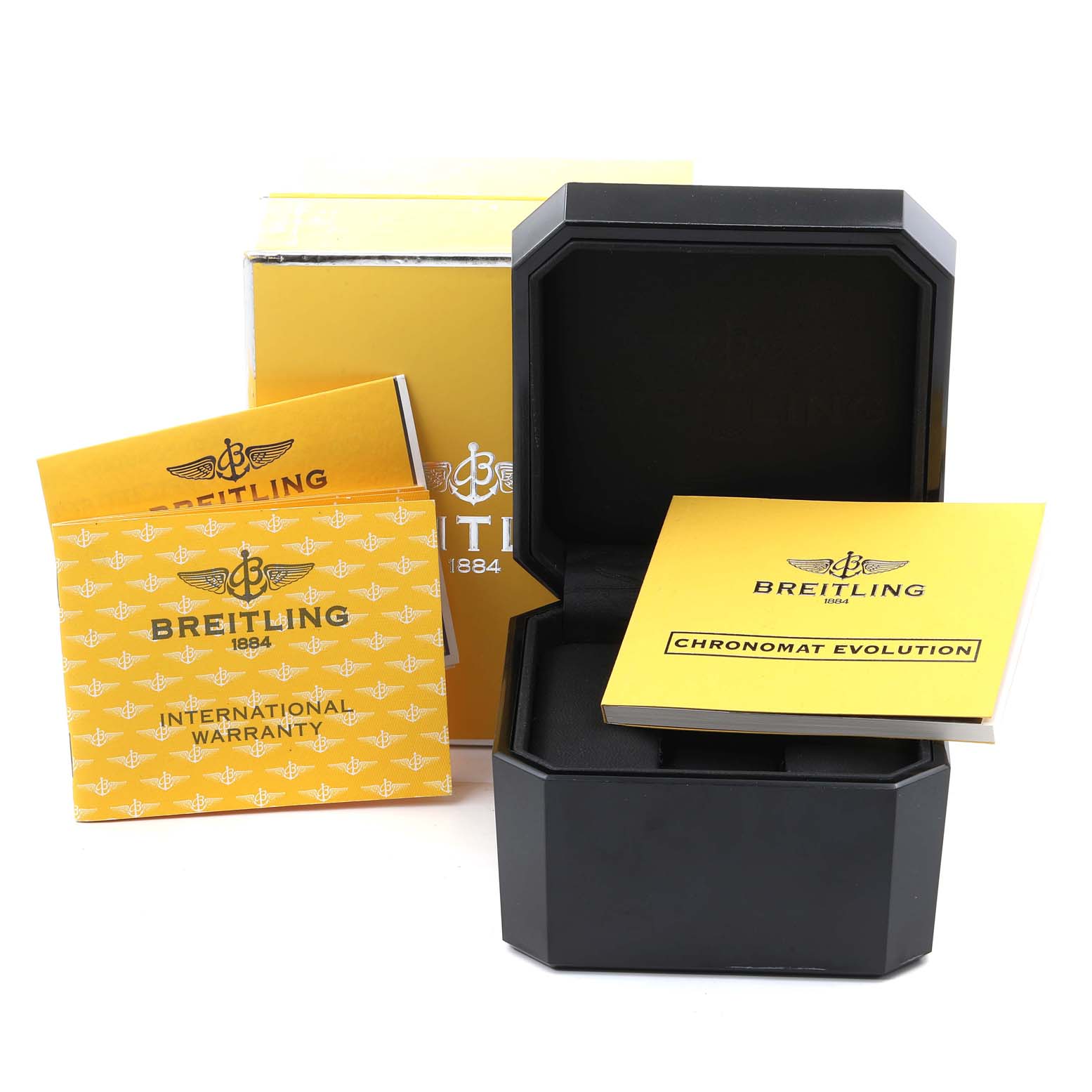 The image shows a Breitling Chronomat B13356 Men
s Stainless Steel Silver Dial B13356 Men
s Stainless Steel Silver Dial watch box, manuals, and international warranty documentation.