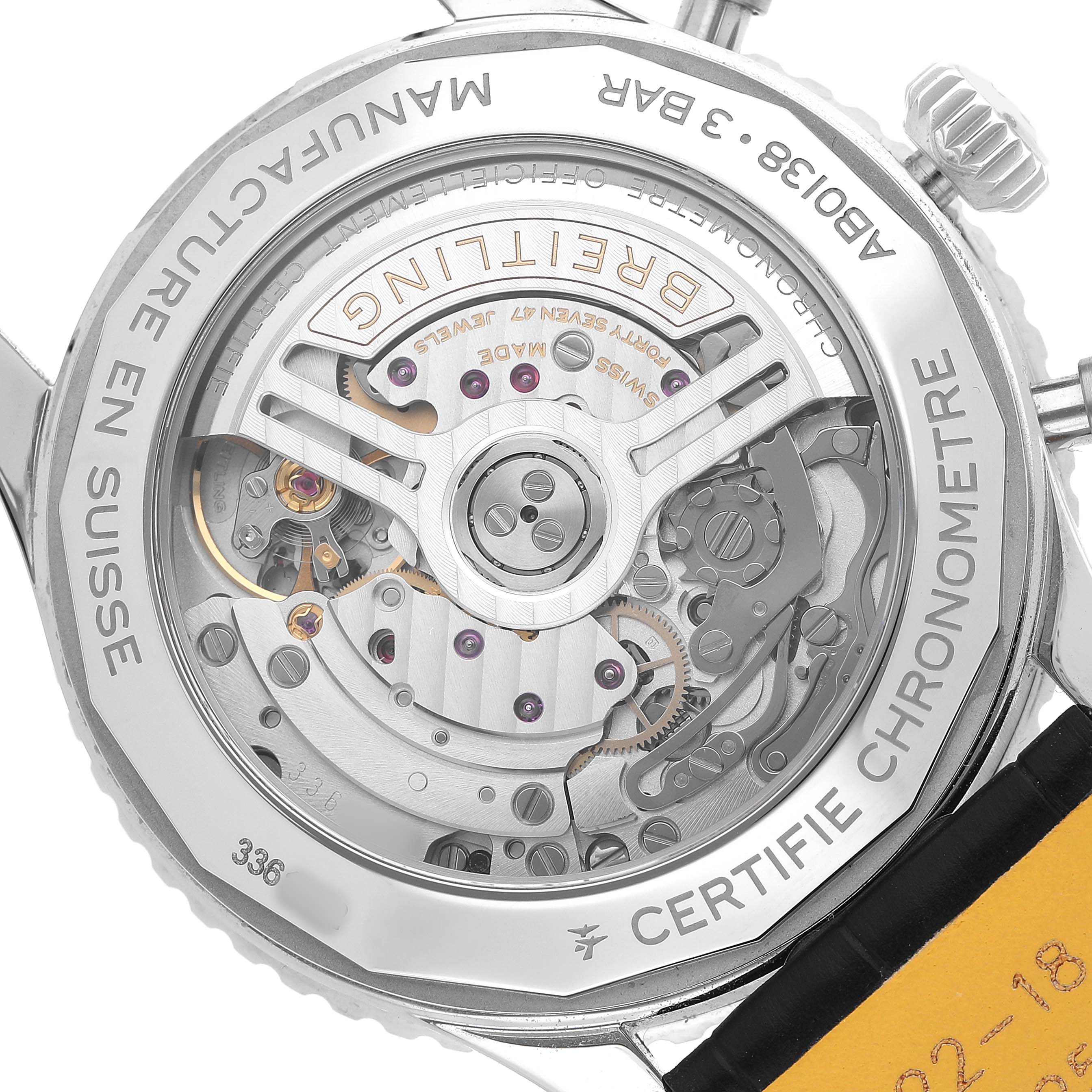 The image shows the back of a Breitling Navitimer AB0138 Men's Stainless Steel Brown Dial watch, highlighting the movement and case details.