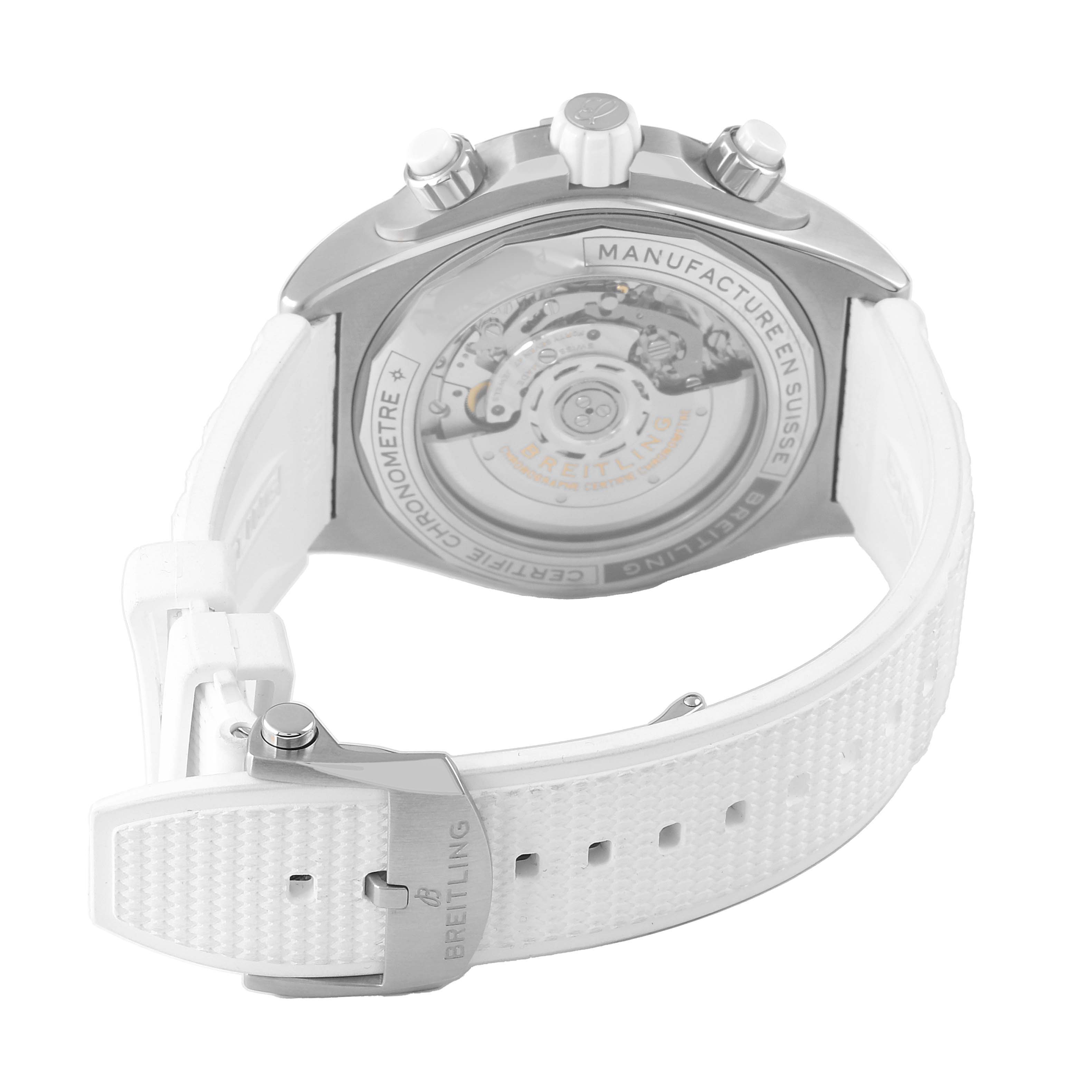 The Breitling Chronomat AB0136 Men's Stainless Steel White Dial watch is shown from the back, highlighting its transparent case back and white strap with a buckle display.