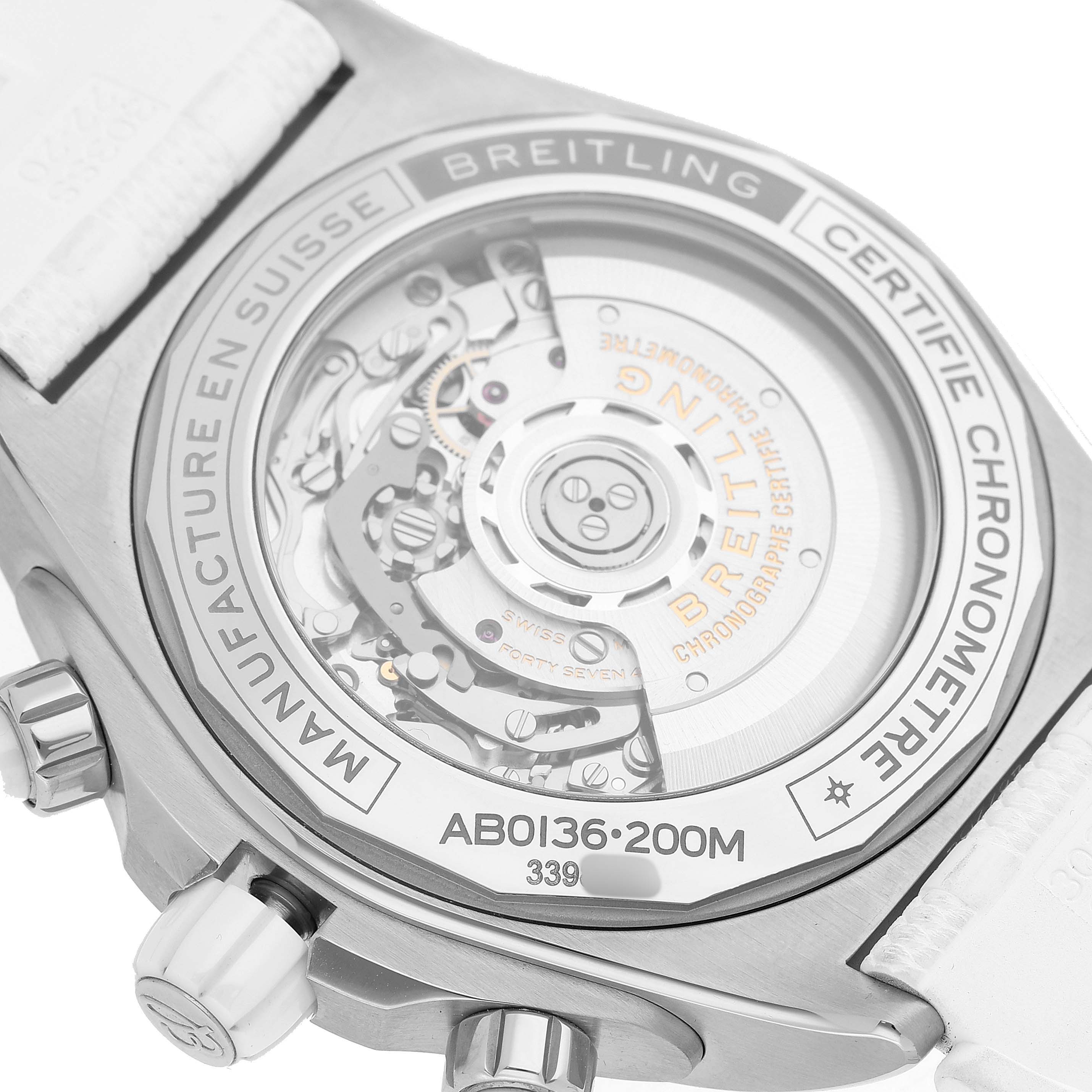 The image shows the back view of a Breitling Chronomat AB0136 Men's Stainless Steel White Dial, highlighting its movement and case engraving.
