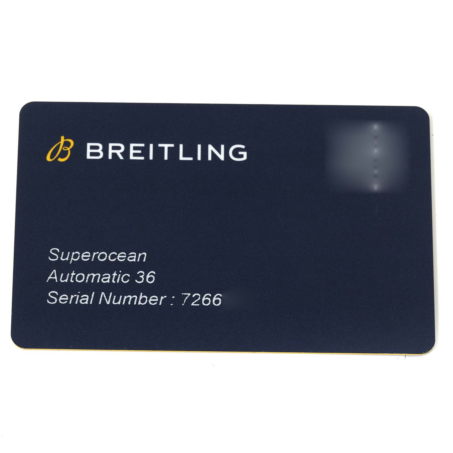 The image shows the identification card for the Breitling A17316 Women's Stainless Steel Orange Dial A17316 Women's Stainless Steel Orange Dial Superocean 36mm with details on the model and serial number.