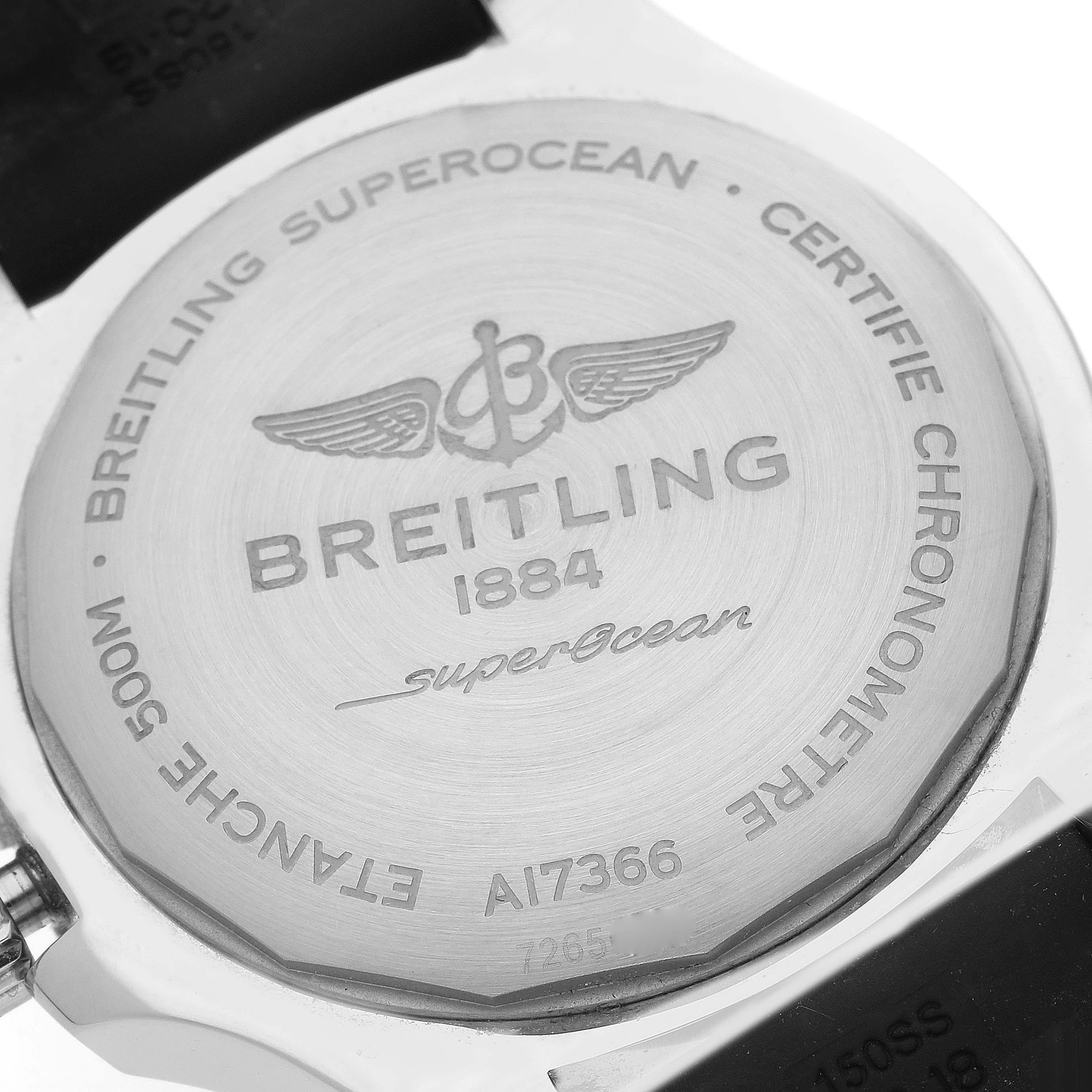 The image shows the back of a Breitling Superocean A17366 Men's Stainless Steel Orange Dial A17366 Men's Stainless Steel Orange Dial watch, highlighting the engraved brand details and model information.