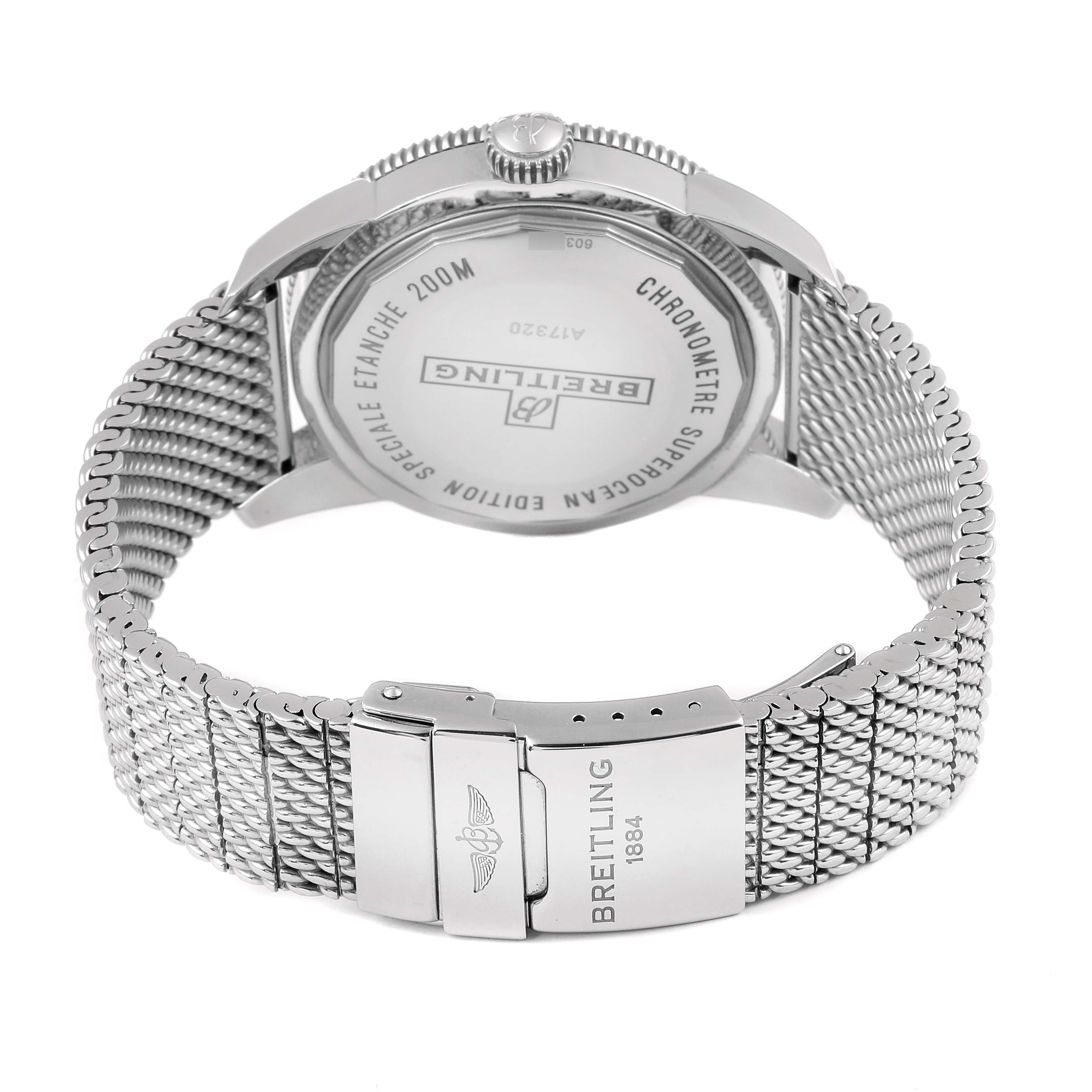 The image shows the backside of a Breitling Superocean A17320 Men
s Stainless Steel Black Dial A17320 Men
s Stainless Steel Black Dial watch, highlighting the case back and mesh bracelet.