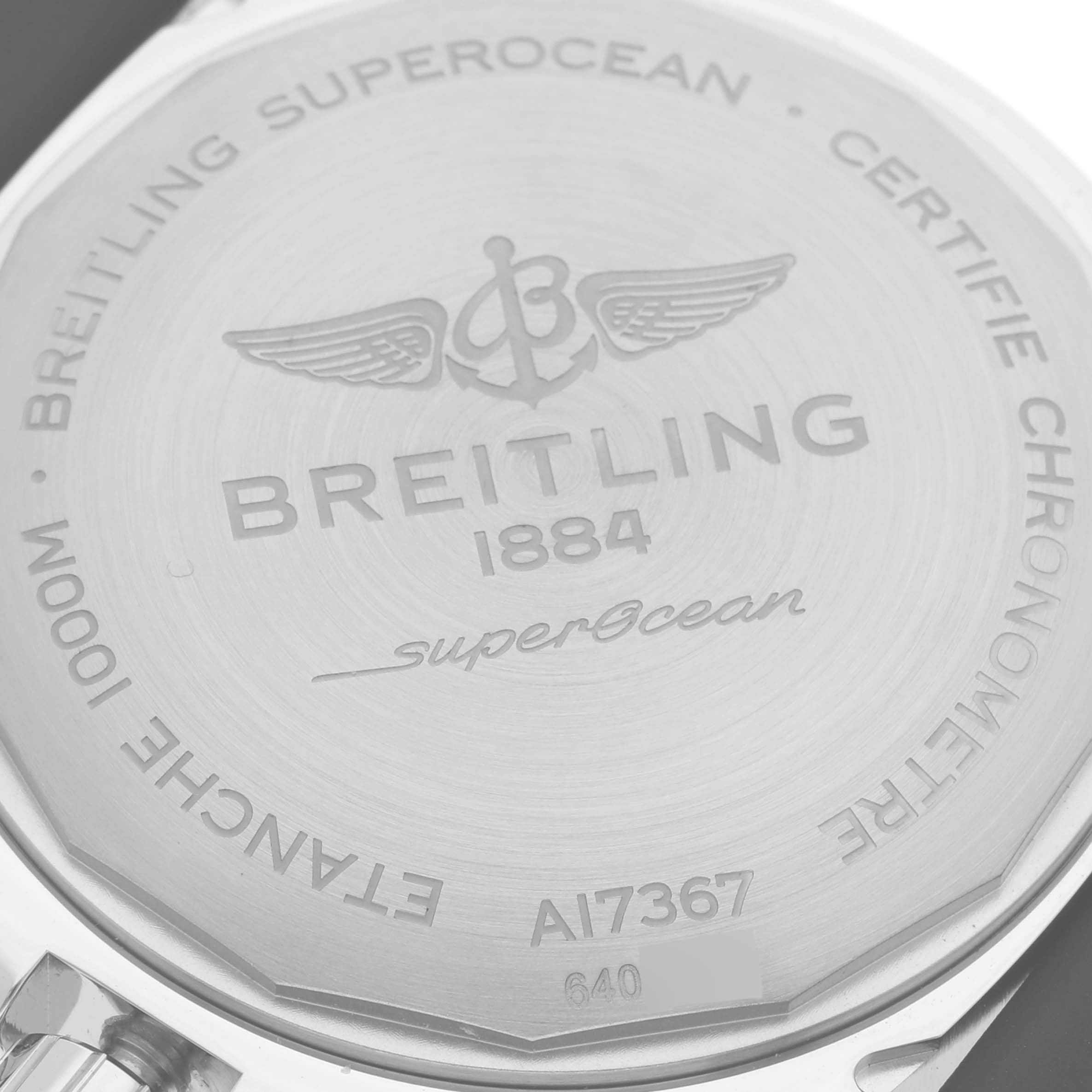 The image shows the back case of a Breitling Superocean A17367 Men's Stainless Steel Yellow Dial A17367 Men's Stainless Steel Yellow Dial watch, including brand engravings and model specifications.