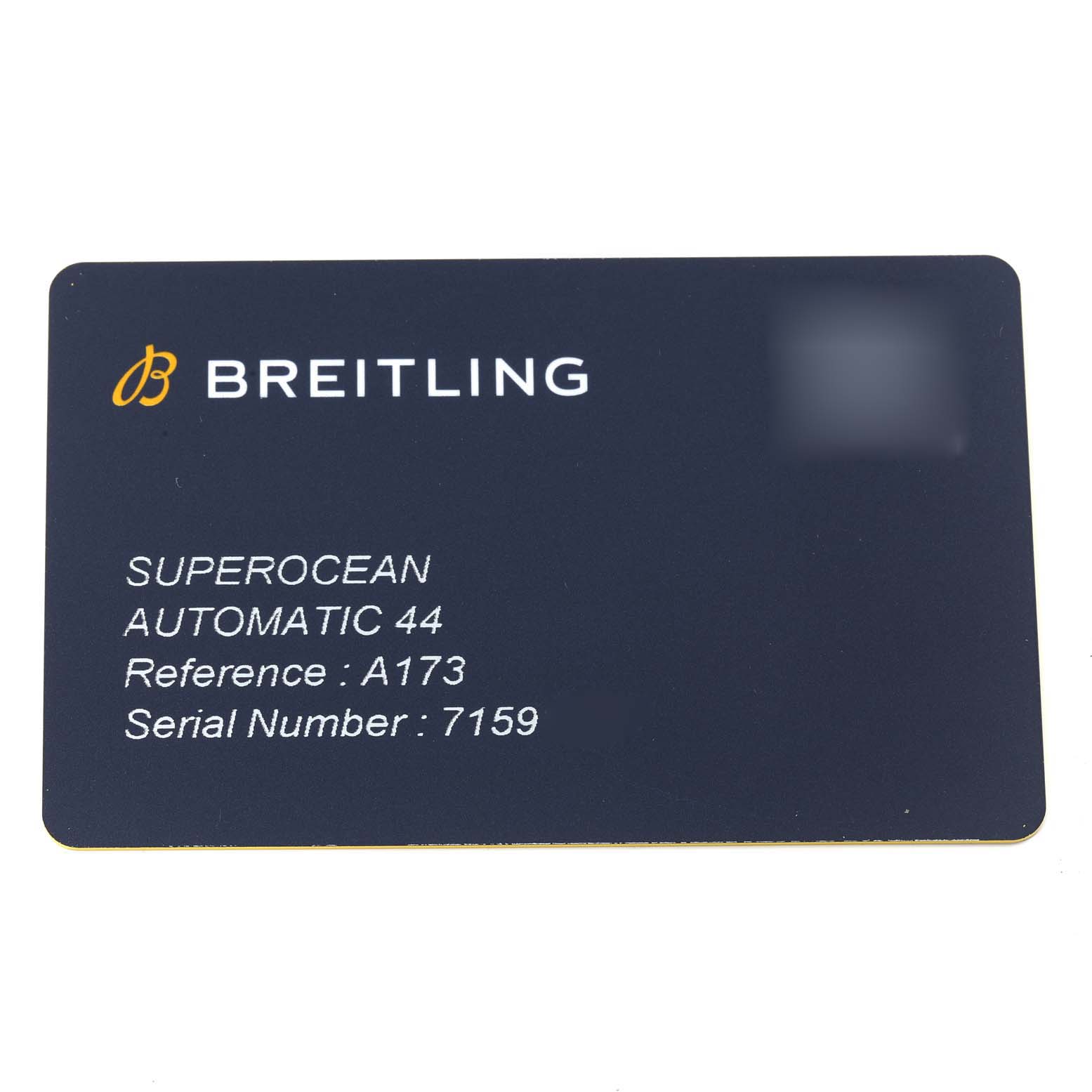 The image shows a Breitling Superocean A17367 Men's Stainless Steel Yellow Dial A17367 Men's Stainless Steel Yellow Dial model warranty card with model details and serial number.