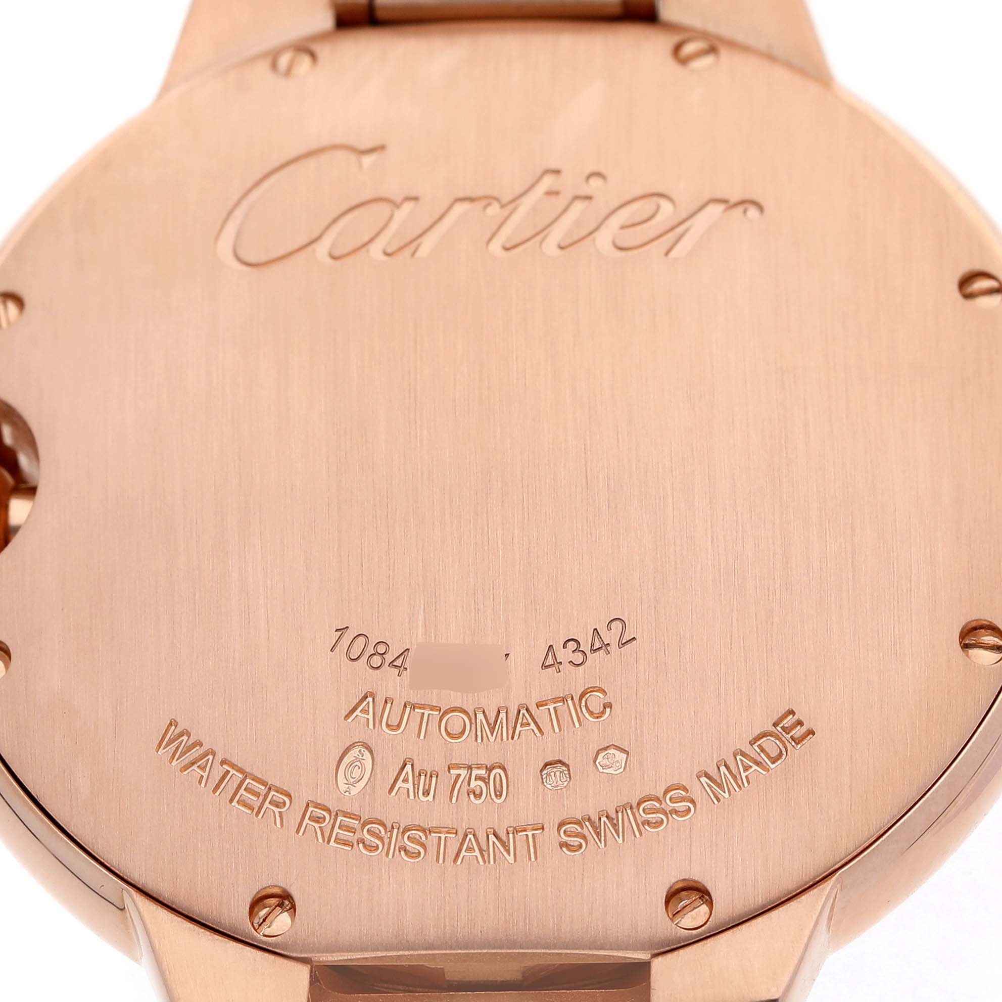The image shows the back case of a Cartier Ballon Bleu WGBB0039 Men's Rose Gold Silver Dial watch, including engravings and screws.