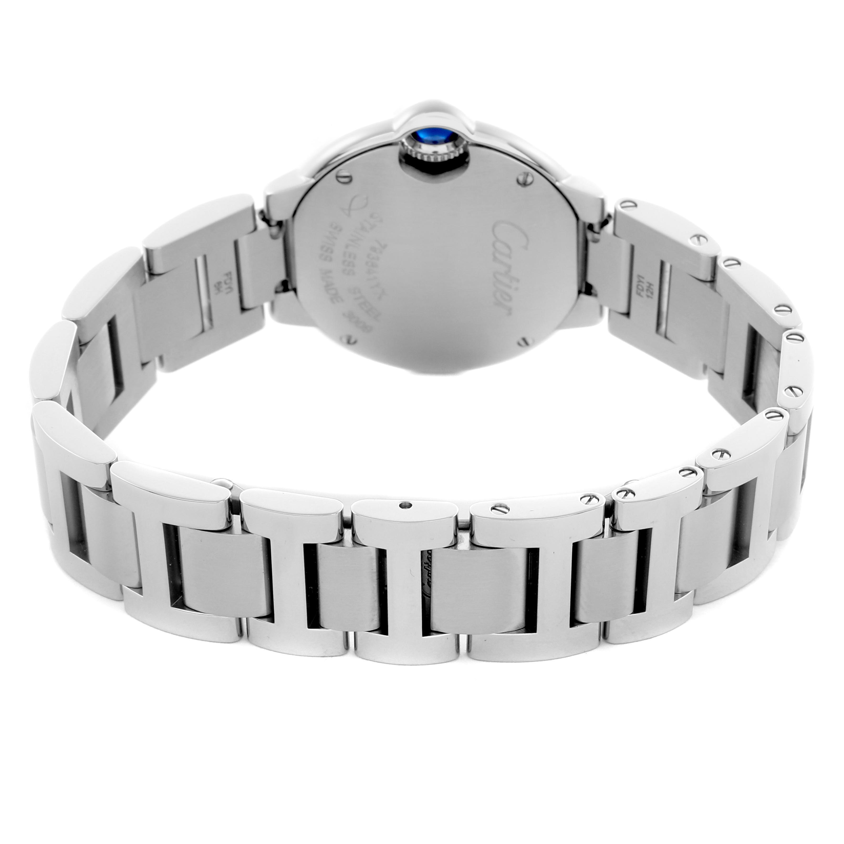 The image shows the back of the Ballon Bleu de Cartier watch, highlighting its metal bracelet and crown from a rear angle.
