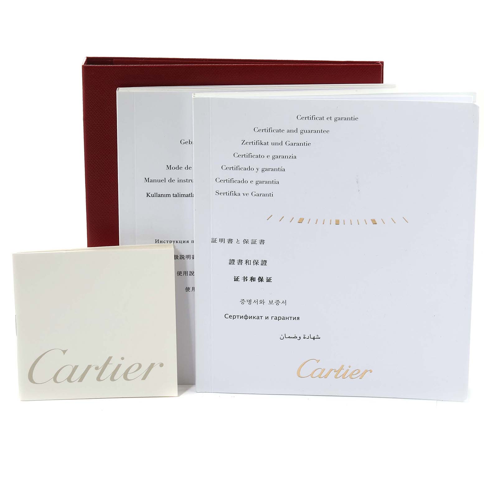 The image shows the certificates and warranty booklets for the Calibre de Cartier watch by Cartier.