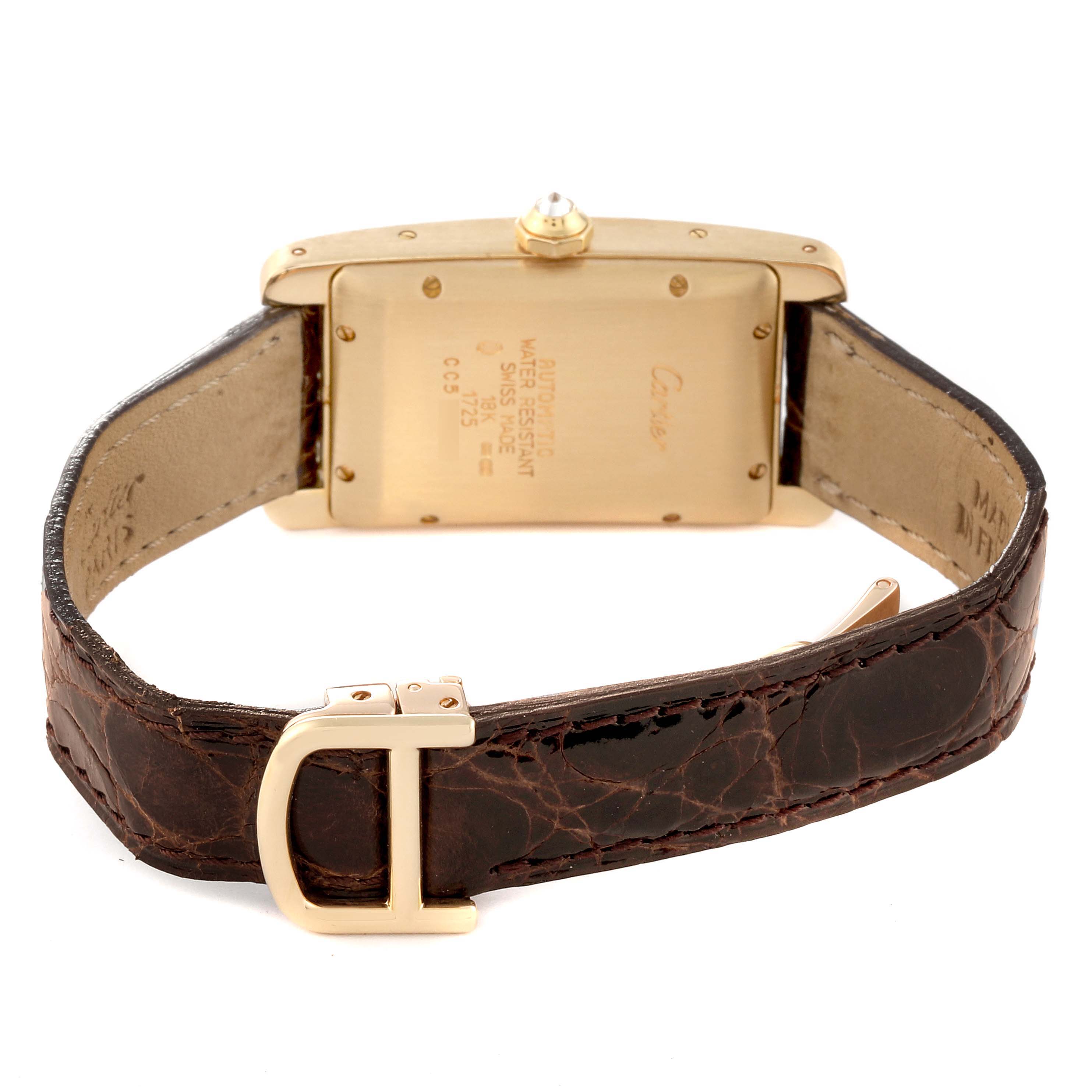 This image shows the back of the Cartier Tank Américaine watch with its gold case and leather strap and buckle.