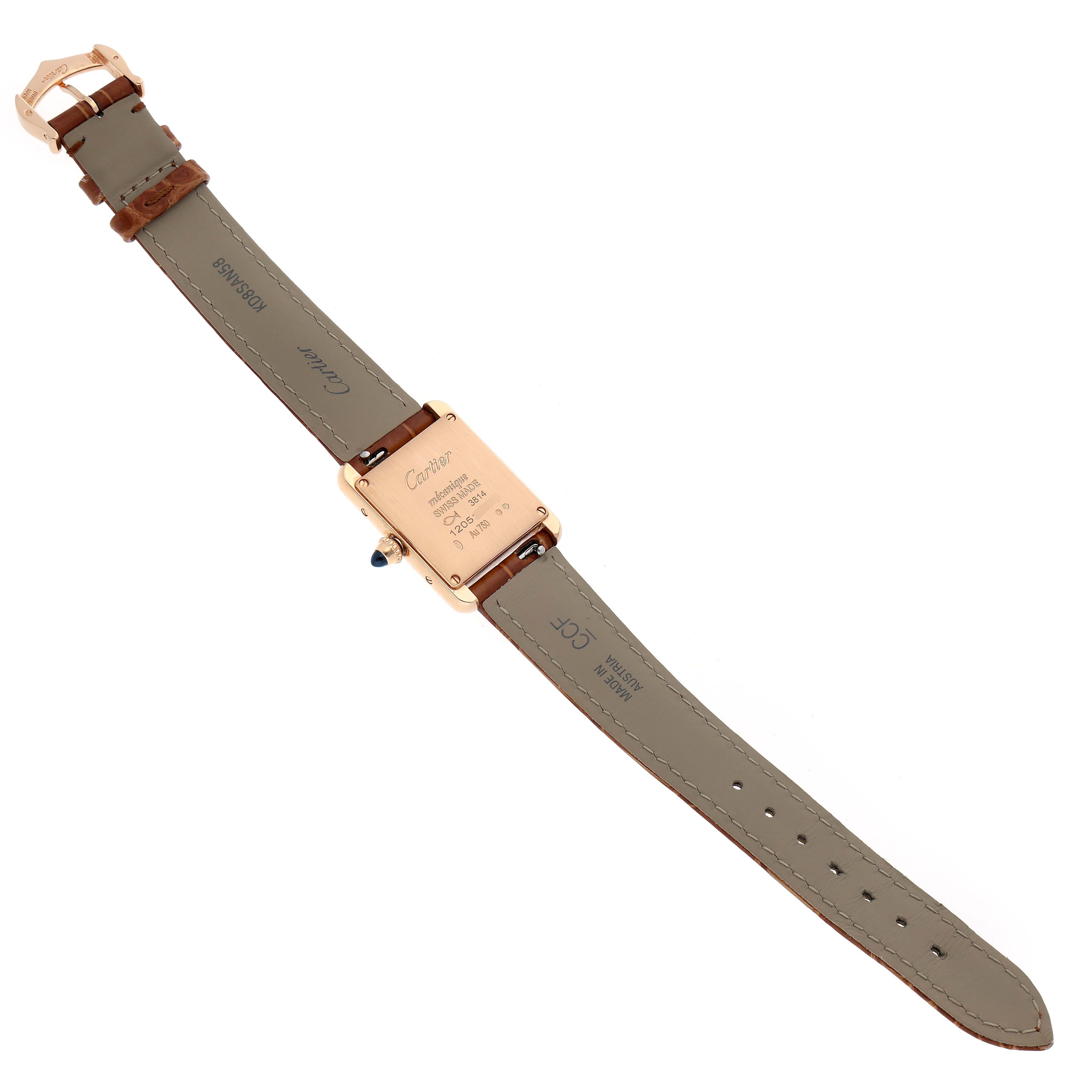 The image shows the back of a Tank Louis Cartier watch, revealing the strap, case back, and buckle.