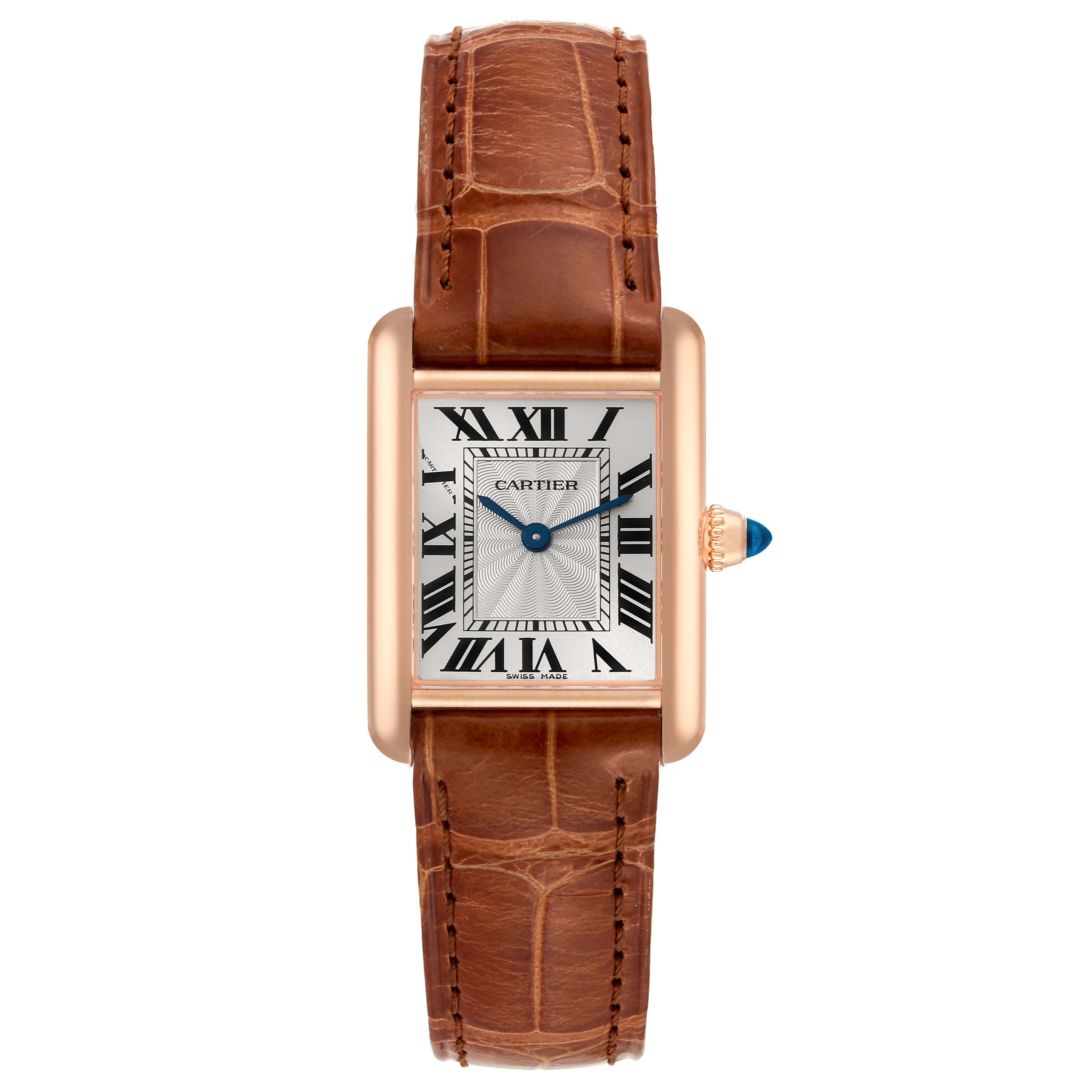 The image shows a front view of the Tank Louis model by Cartier, featuring its rectangular dial, brown leather strap, and gold crown.