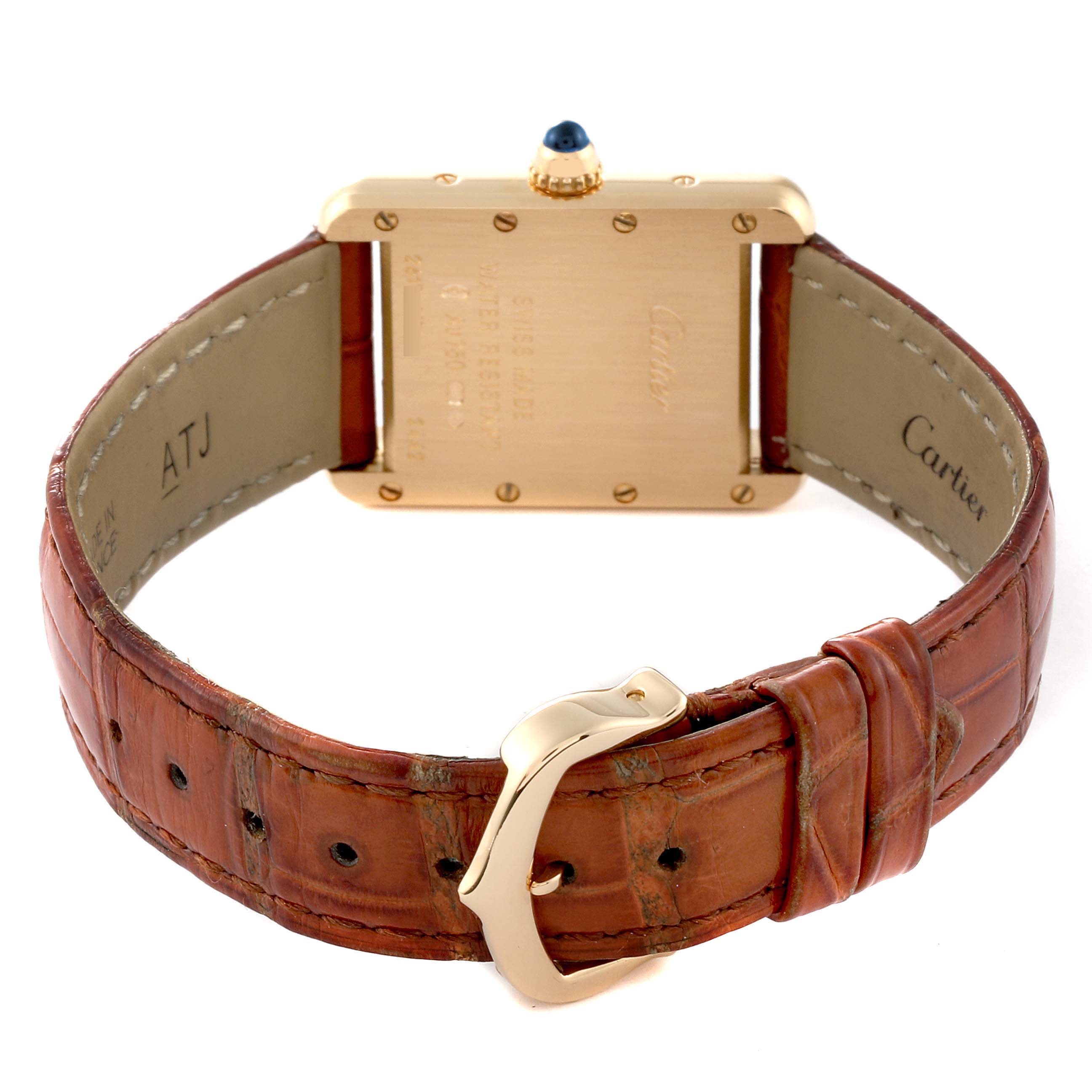 This image shows the Cartier Tank Louis W1529856 Women's Yellow Gold Silver Dial W1529856 Women's Yellow Gold Silver Dial watch from the back, displaying the case, crown, and brown leather strap with buckle.