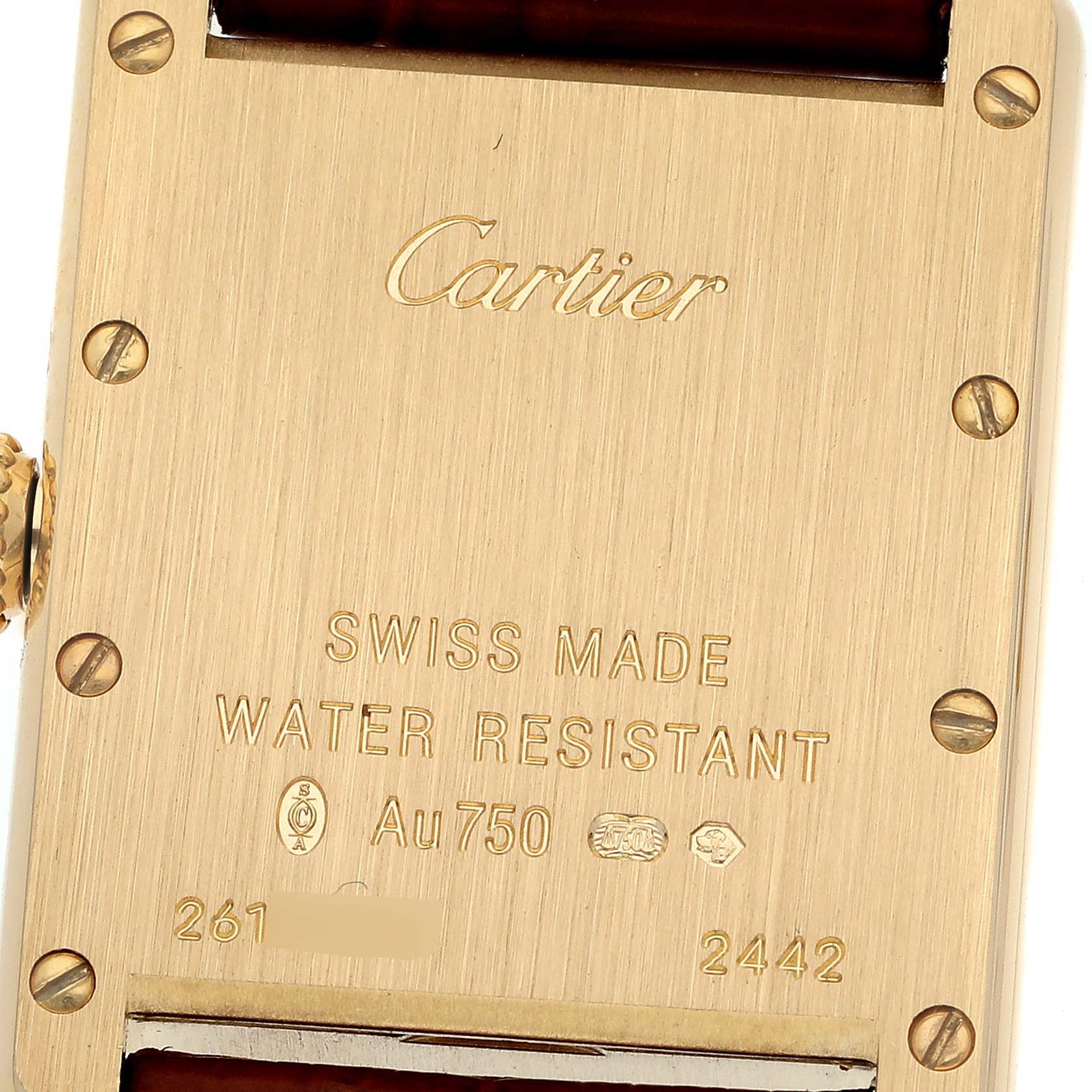 The image shows the back case of a Cartier Tank Louis W1529856 Women's Yellow Gold Silver Dial W1529856 Women's Yellow Gold Silver Dial watch, highlighting its inscriptions and part of the strap.