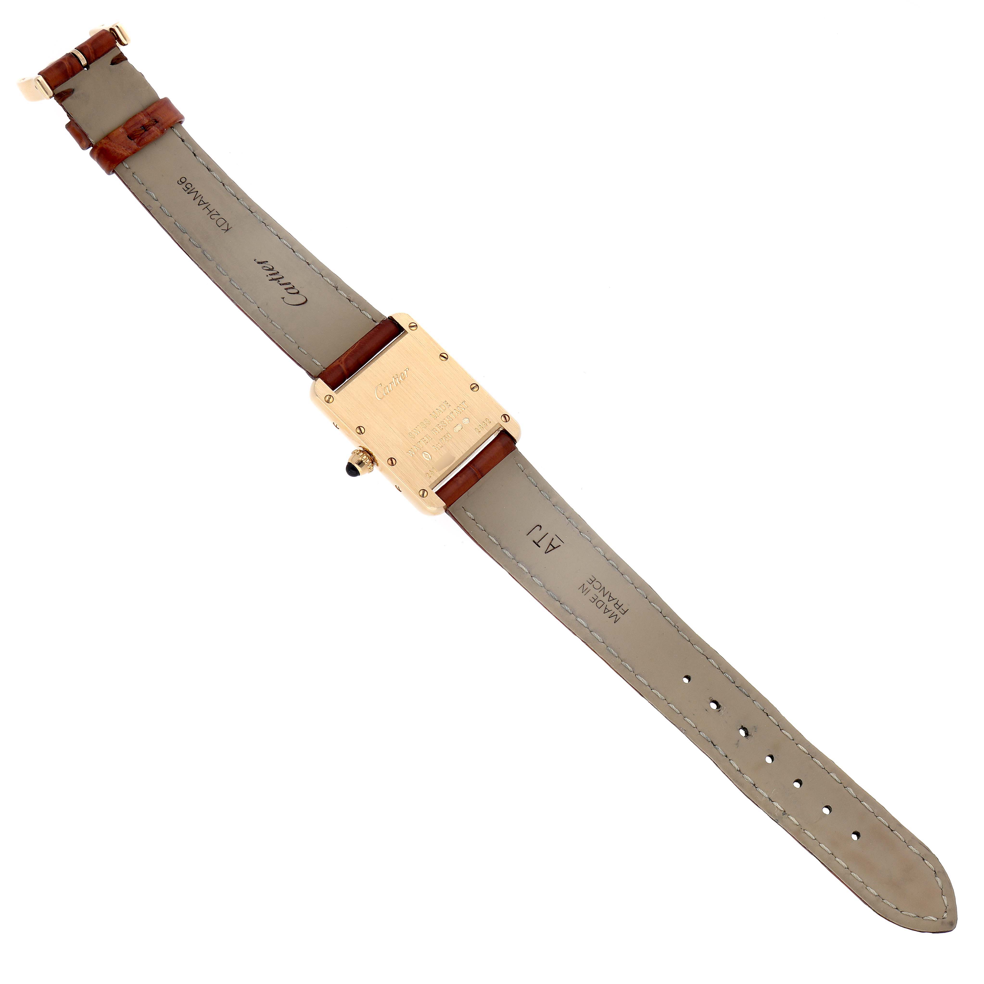 This image shows the back view of a Cartier Tank Louis W1529856 Women's Yellow Gold Silver Dial W1529856 Women's Yellow Gold Silver Dial watch, highlighting the case back and leather strap.