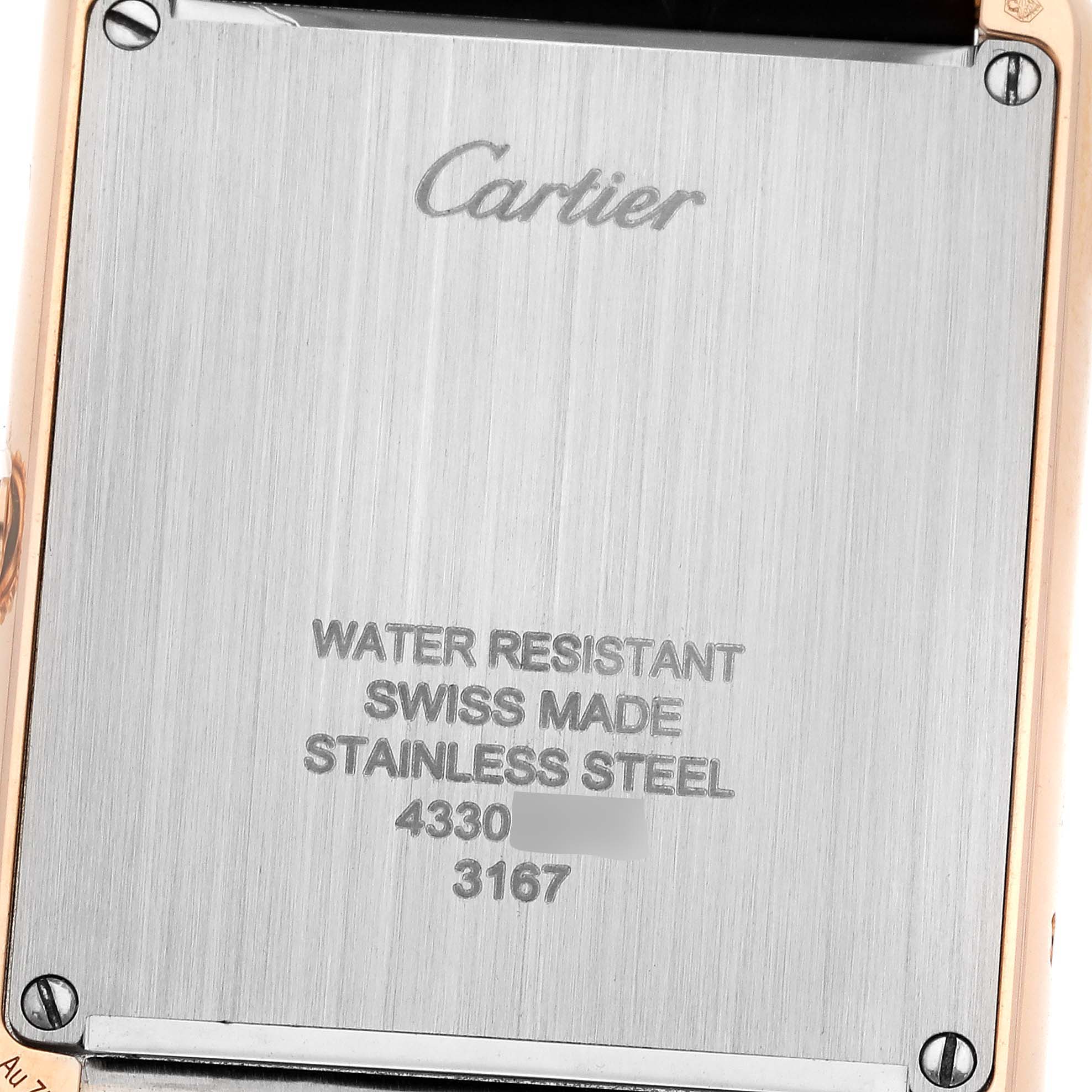 This image shows the case back of a Cartier Tank Solo W5200025 Men
s Steel and Gold (two tone) Silver Dial W5200025 Men
s Steel and Gold (two tone) Silver Dial watch, displaying the brand name, material, and other inscriptions.