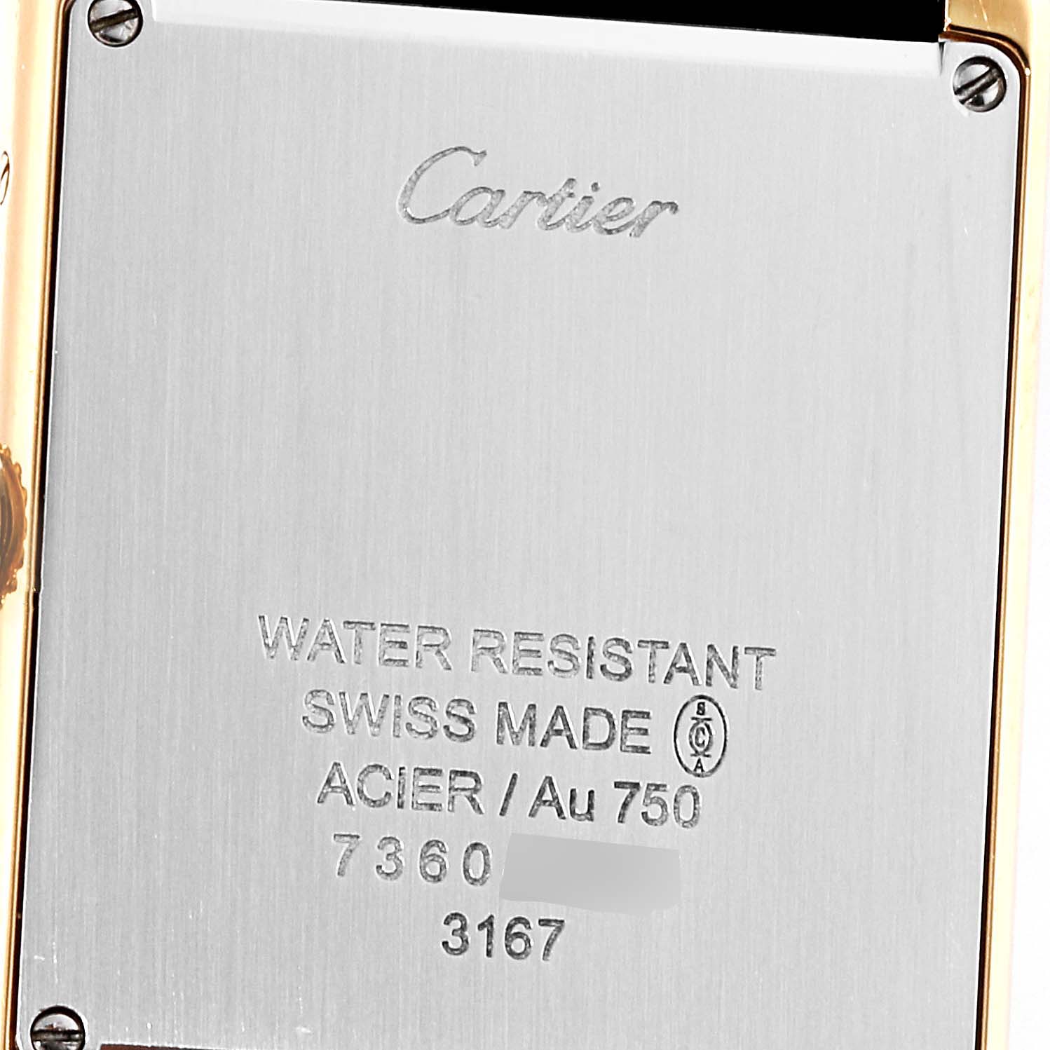 This is a close-up view of the case back of a Cartier Tank Solo W5200004 Men
s Steel and Gold (two tone) Silver Dial W5200004 Men
s Steel and Gold (two tone) Silver Dial watch showing engraved details.