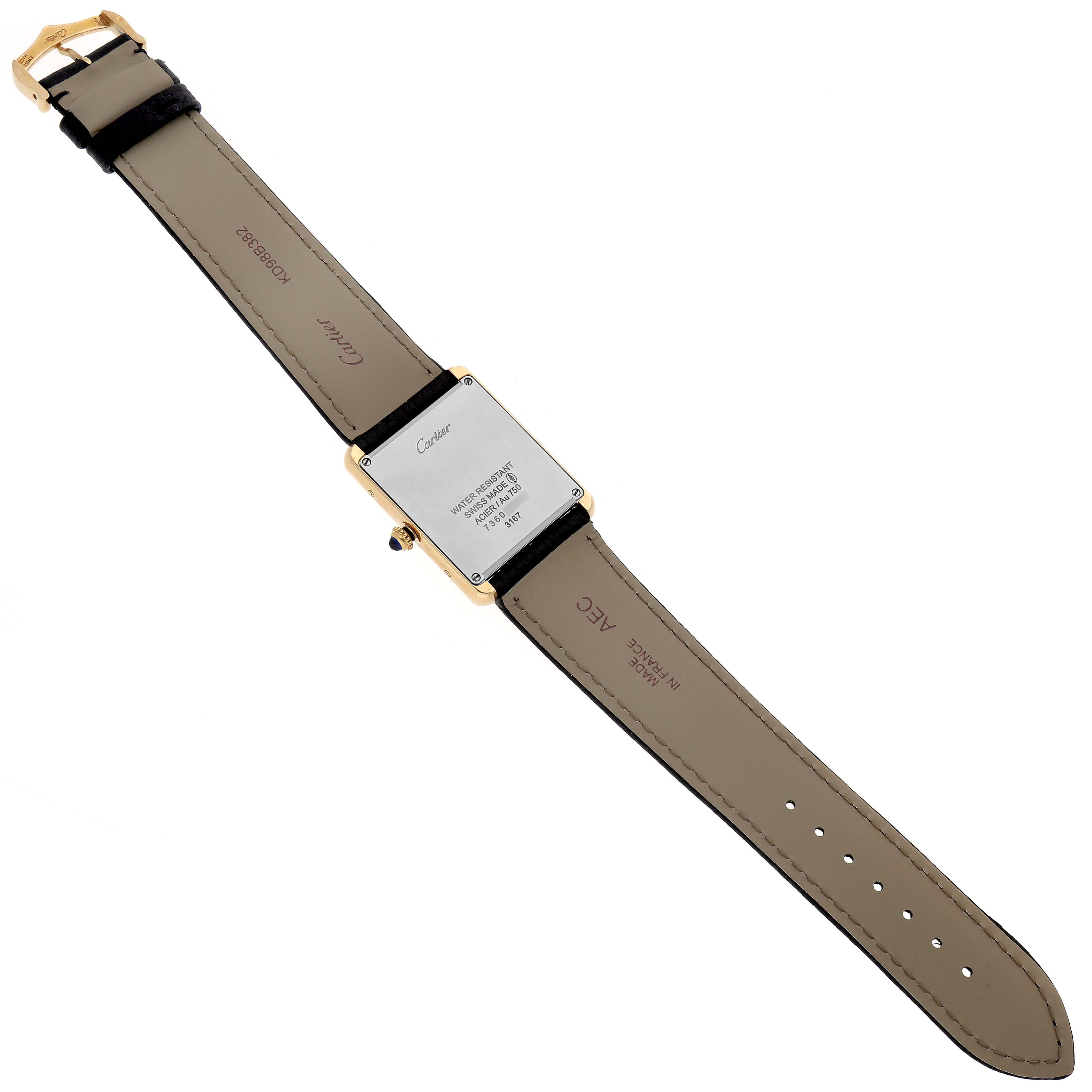 The image shows the back view of a Tank Solo model by Cartier, including the case back and the leather strap.