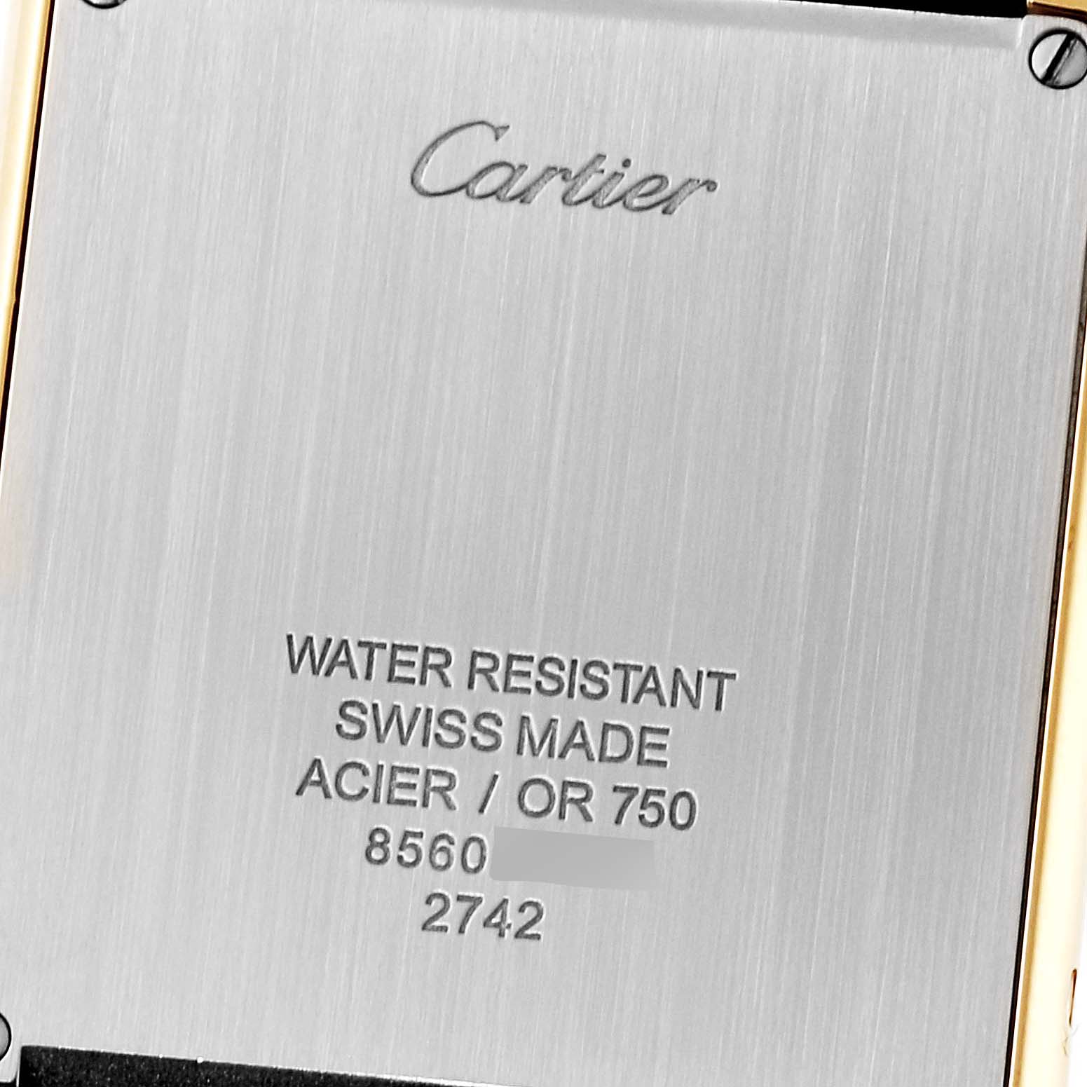 This image shows the back case of a Cartier Tank Solo W1018855 Men
s Steel and Gold (two tone) Silver Dial W1018855 Men
s Steel and Gold (two tone) Silver Dial watch with engraved details about its specifications.