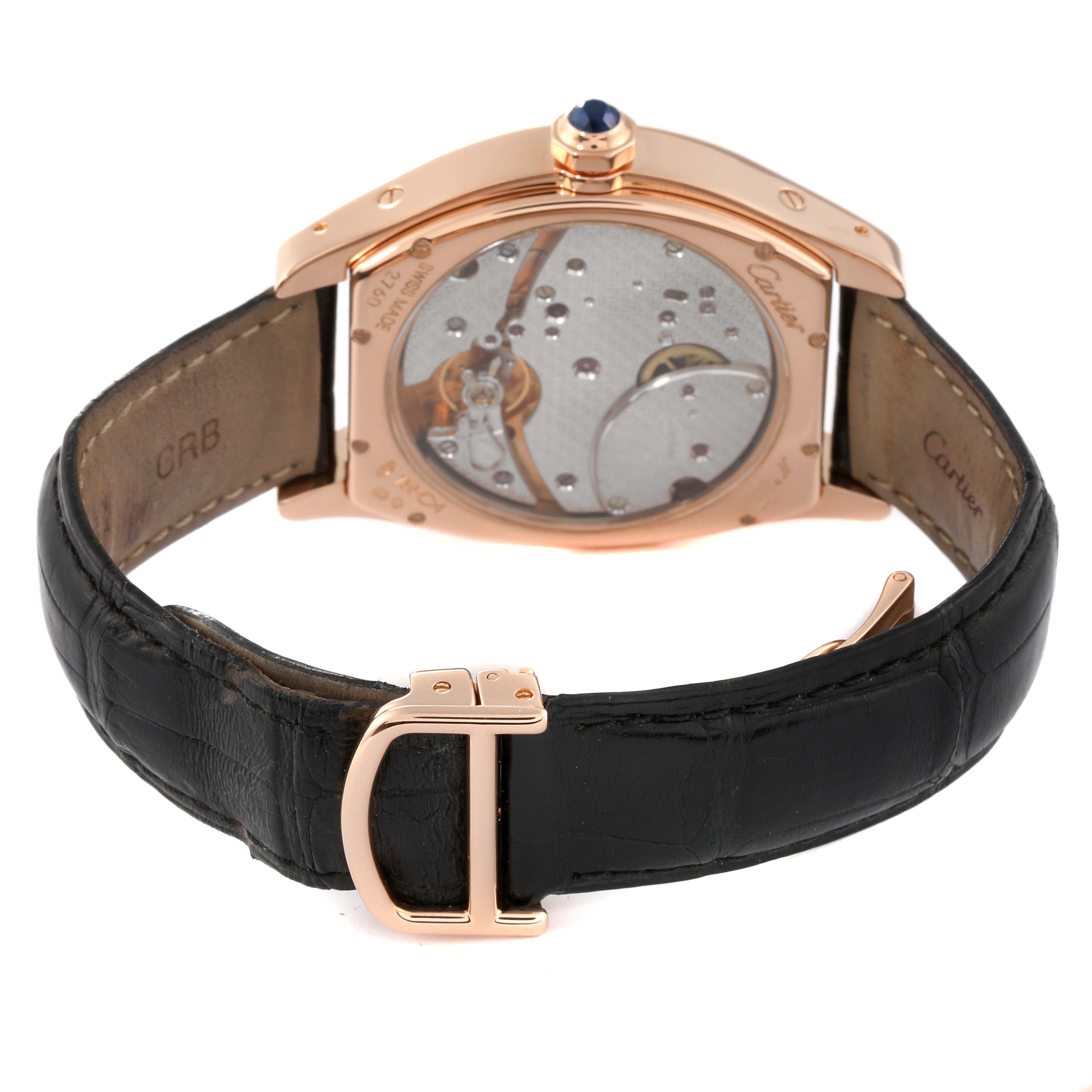 The image shows the back of the Cartier Tortue W1545851 Men
s Rose Gold Silver Dial W1545851 Men
s Rose Gold Silver Dial watch, highlighting the movement and black leather strap with a gold buckle.