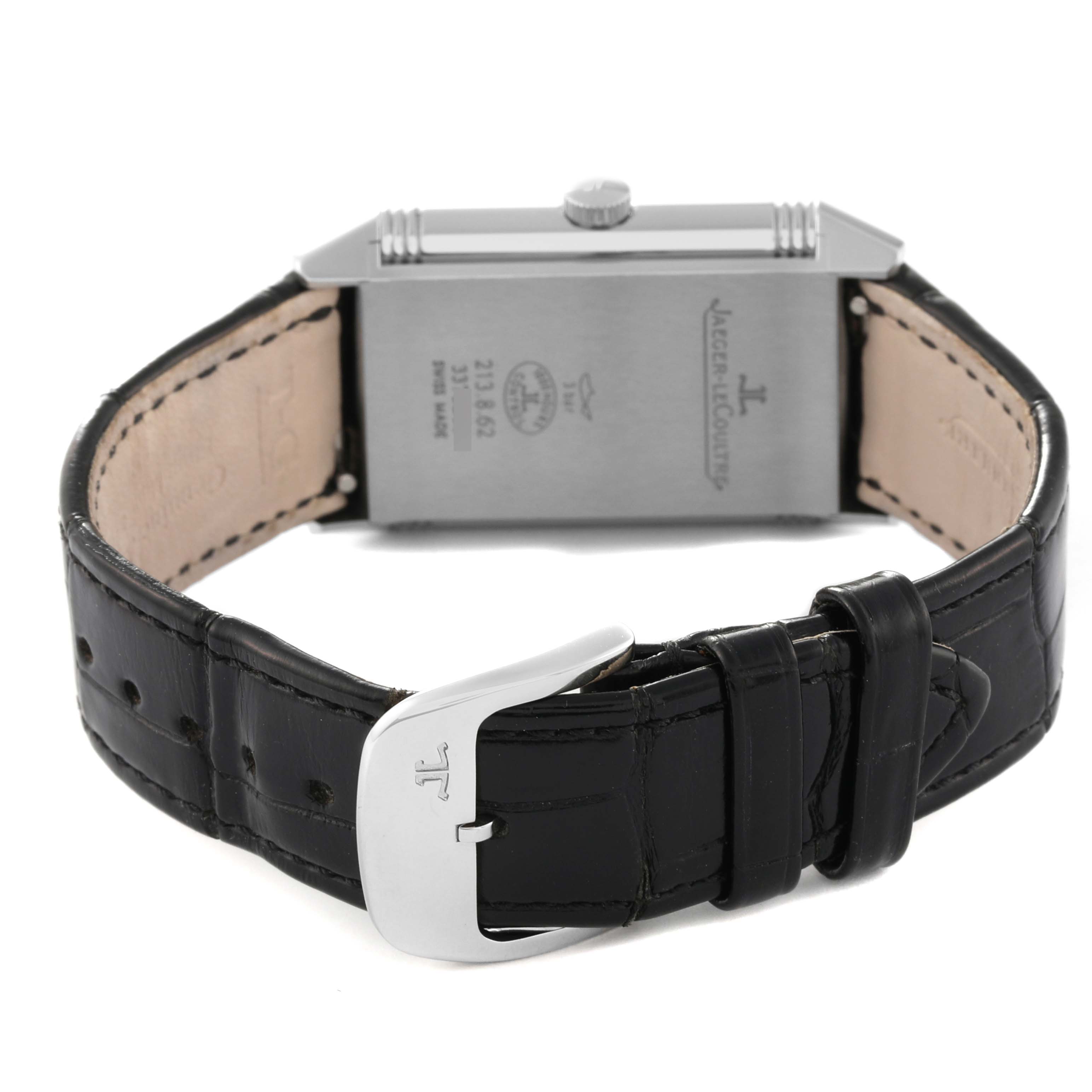 This image shows the back and strap of a Jaeger-LeCoultre Reverso watch, highlighting the buckle and engraved case back.