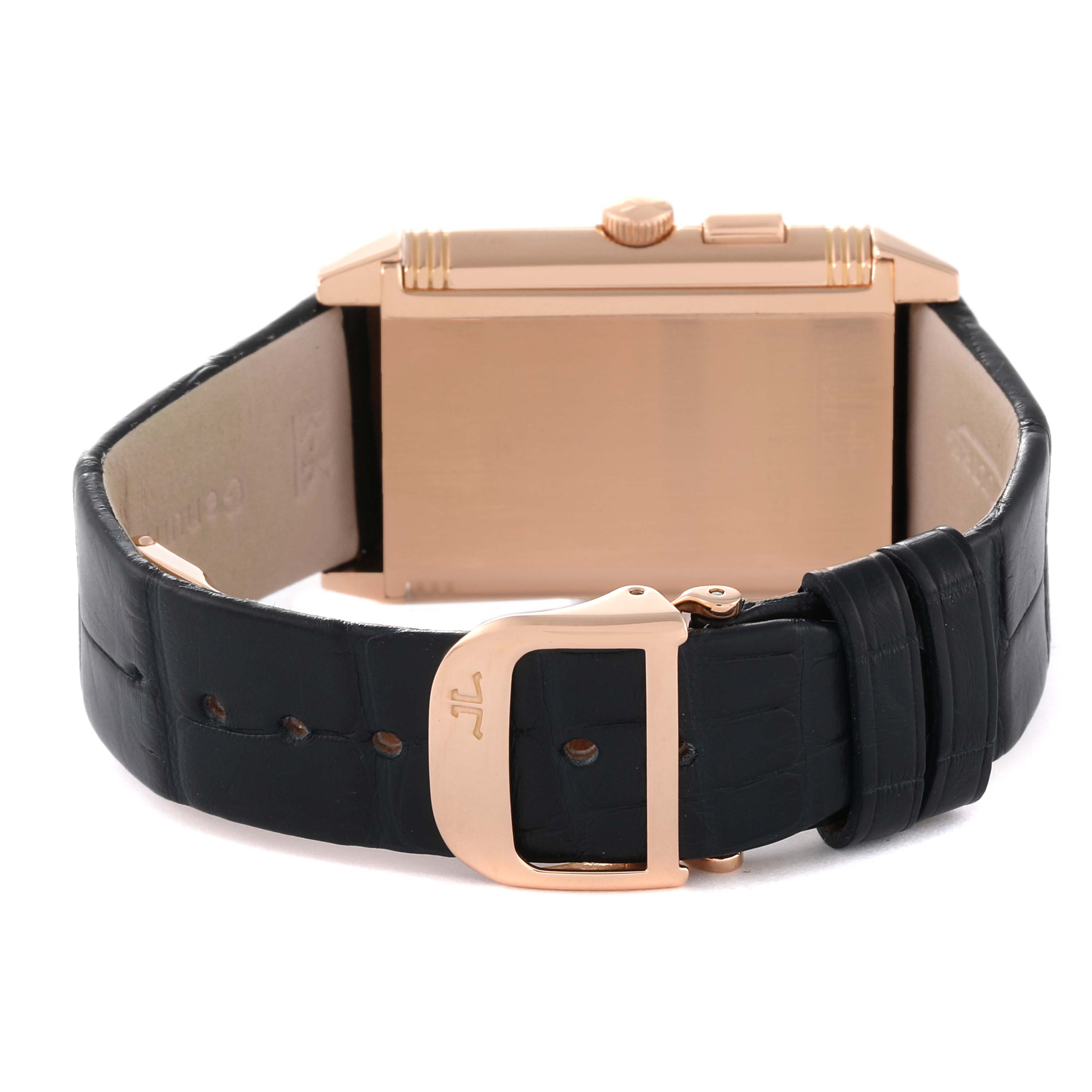 The image shows the back of a Jaeger LeCoultre Reverso Q2712410 Men
s Rose Gold Silver Dial Q2712410 Men
s Rose Gold Silver Dial watch with its leather strap and clasp.