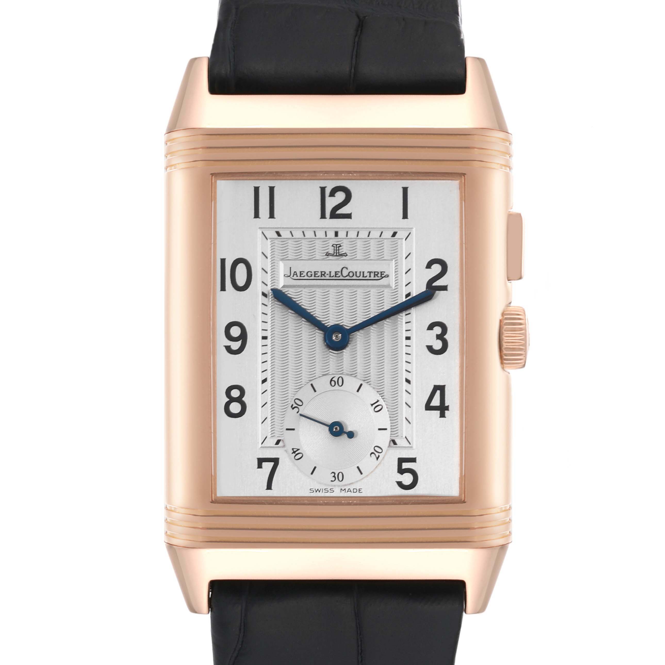 The image shows a front view of the Jaeger-LeCoultre Reverso watch, displaying its dial, case, crown, and strap.