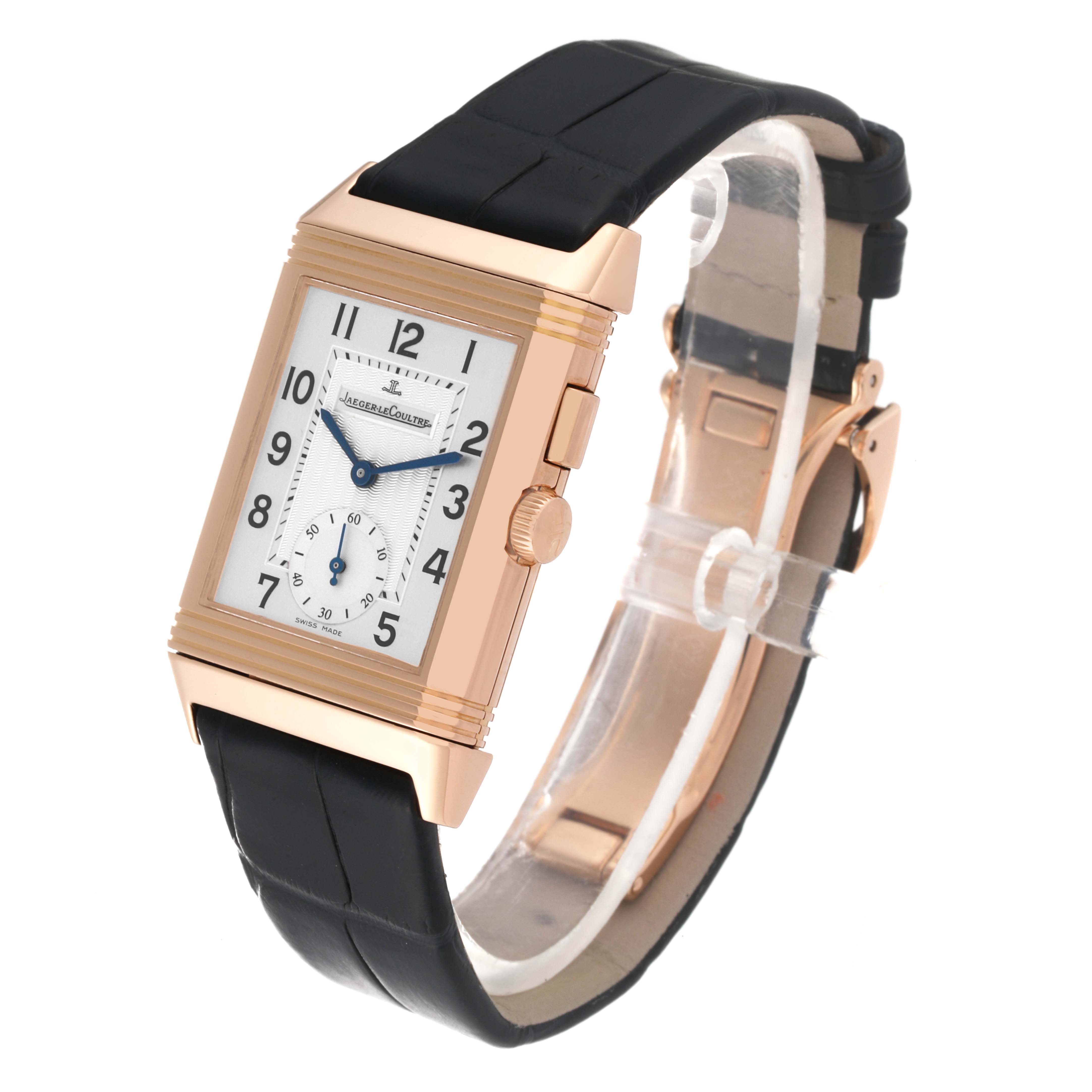 The image shows a Jaeger LeCoultre Reverso Q2712410 Men
s Rose Gold Silver Dial Q2712410 Men
s Rose Gold Silver Dial watch at a slight angle, highlighting its rectangular face, crown, and black strap.