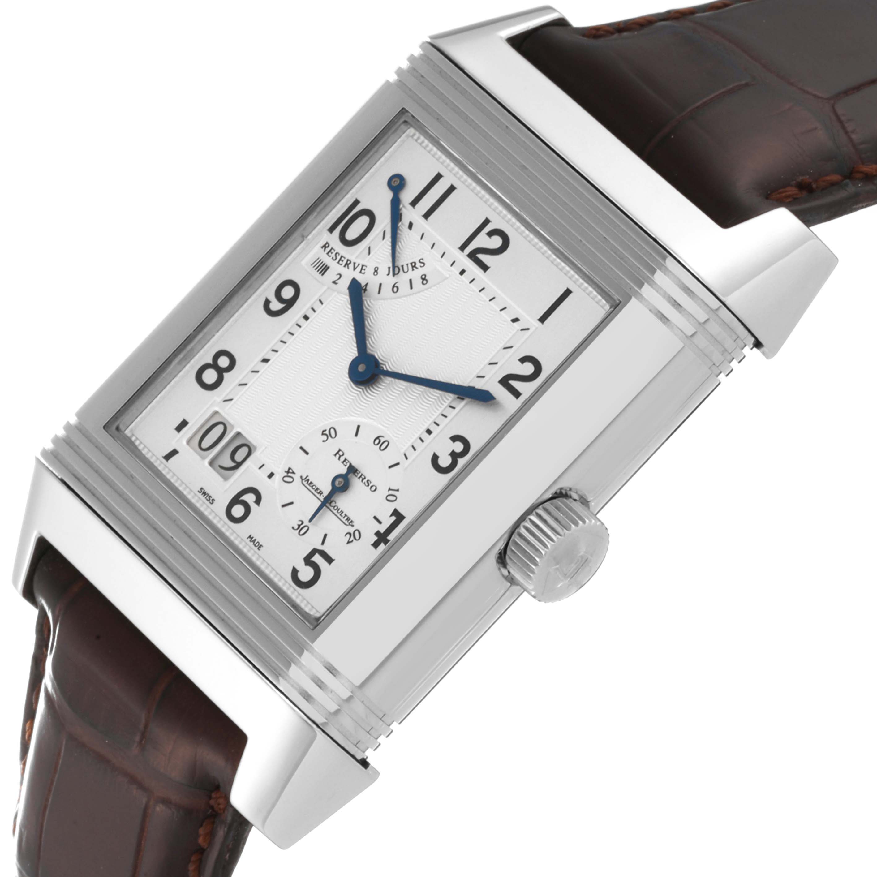 The Jaeger-LeCoultre Reverso watch is shown from an angled side view, highlighting the dial, crown, and leather strap.