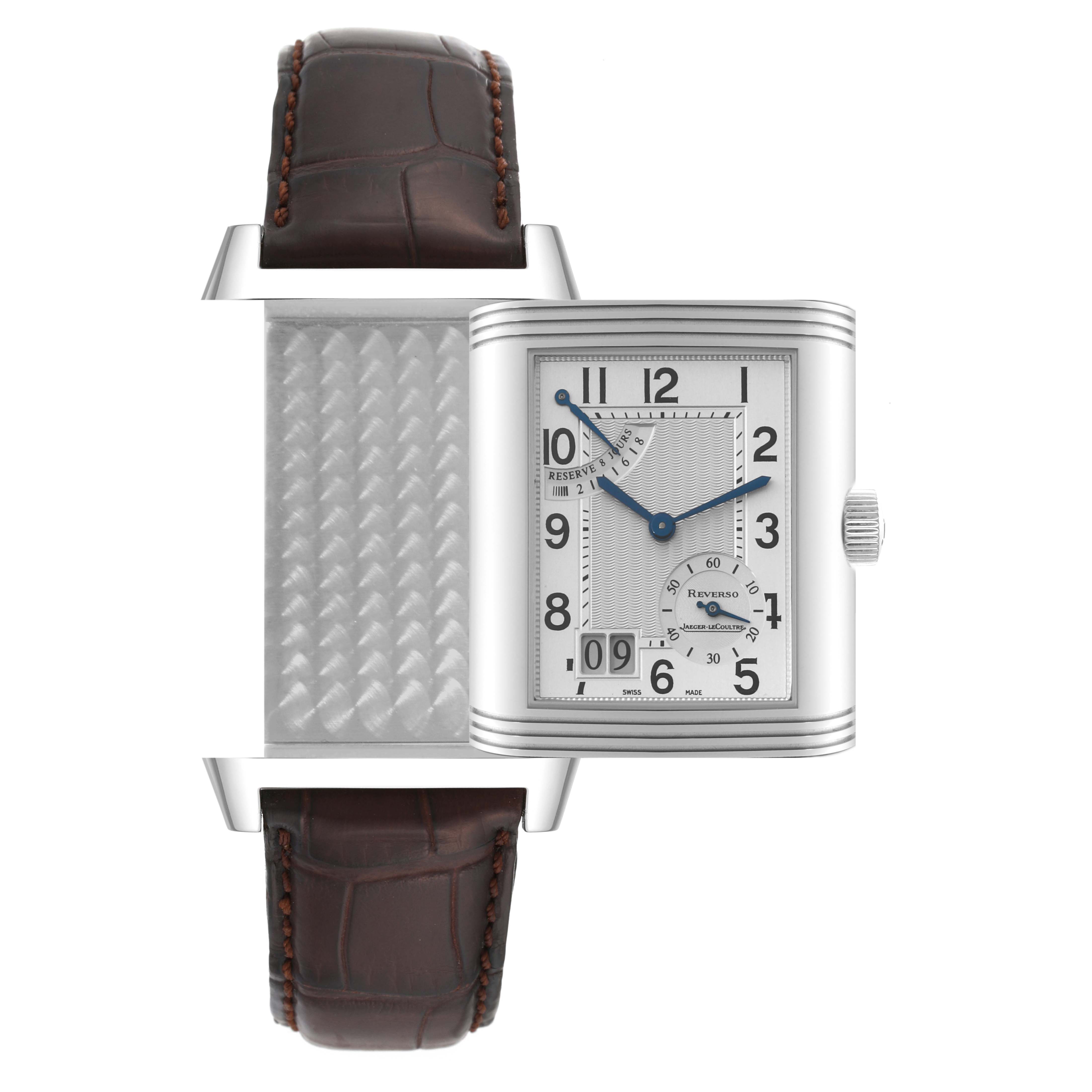 The image shows a Jaeger-LeCoultre Reverso watch in mid-rotation, displaying both the dial and the back panel with the strap.