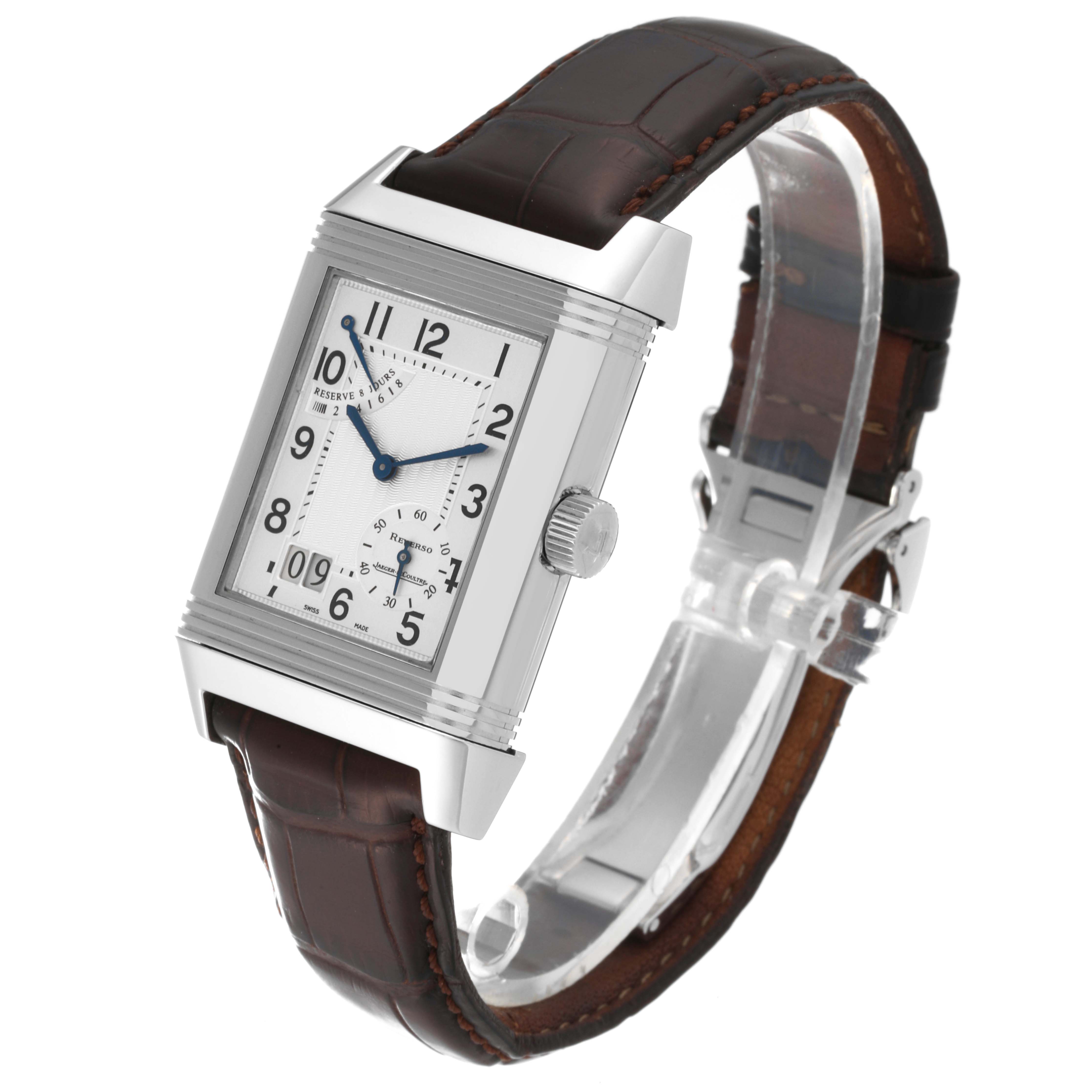 The image shows a Jaeger-LeCoultre Reverso watch at an oblique angle, highlighting its rectangular dial and leather strap.