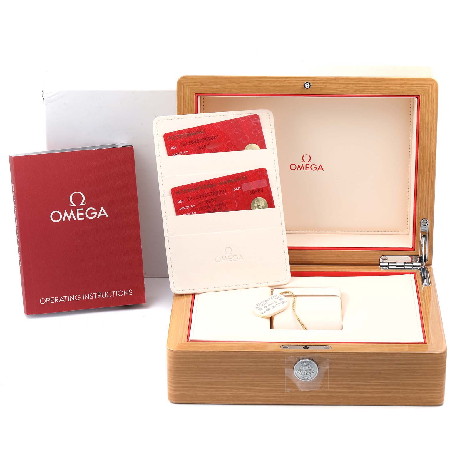 This image shows the wooden box, warranty cards, instruction manual, and certificate for the Omega Aqua Terra 231.10.42.22.02.001  Men
s Stainless Steel Silver Dial 231.10.42.22.02.001  Men
s Stainless Steel Silver Dial watch.