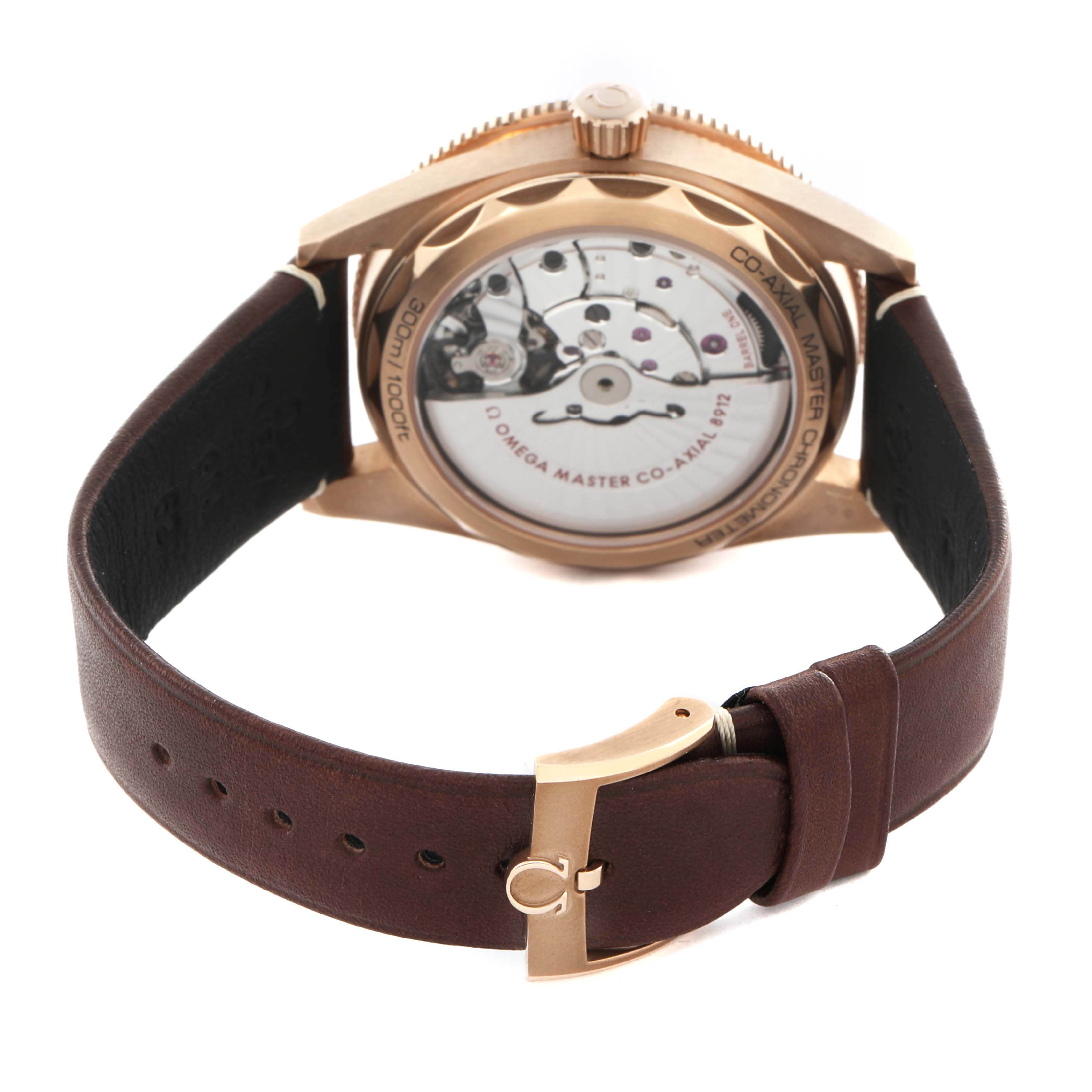 The image shows the back view of the Omega Seamaster 234.92.41.21.10.001 Men
s Rose Gold Brown Dial 234.92.41.21.10.001 Men
s Rose Gold Brown Dial, highlighting the movement and leather strap with a clasp.