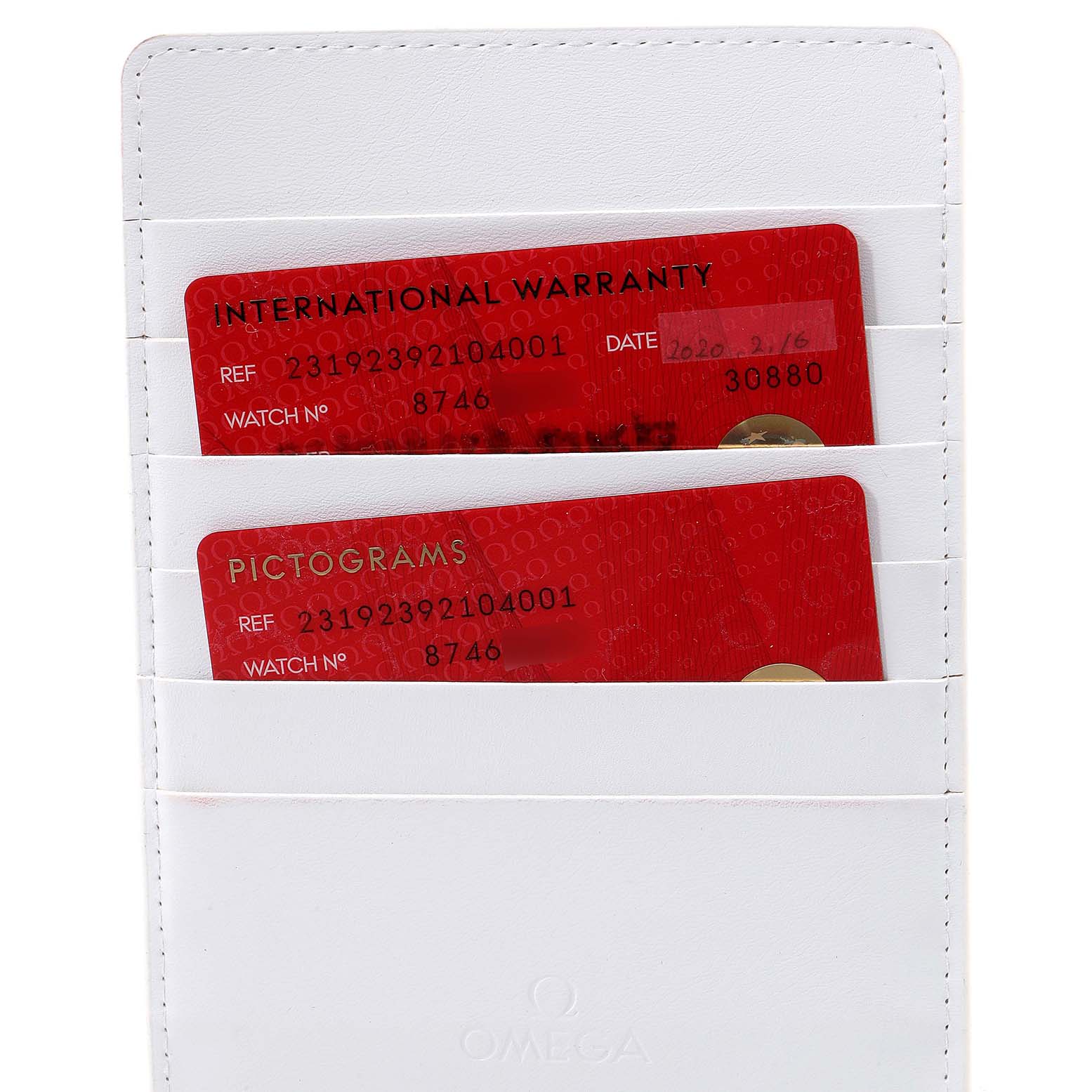 This image shows the international warranty and pictograms cards for the Omega Aqua Terra 231.92.39.21.04.001  Men's Titanium White Dial 231.92.39.21.04.001  Men's Titanium White Dial model along with a white cardholder.